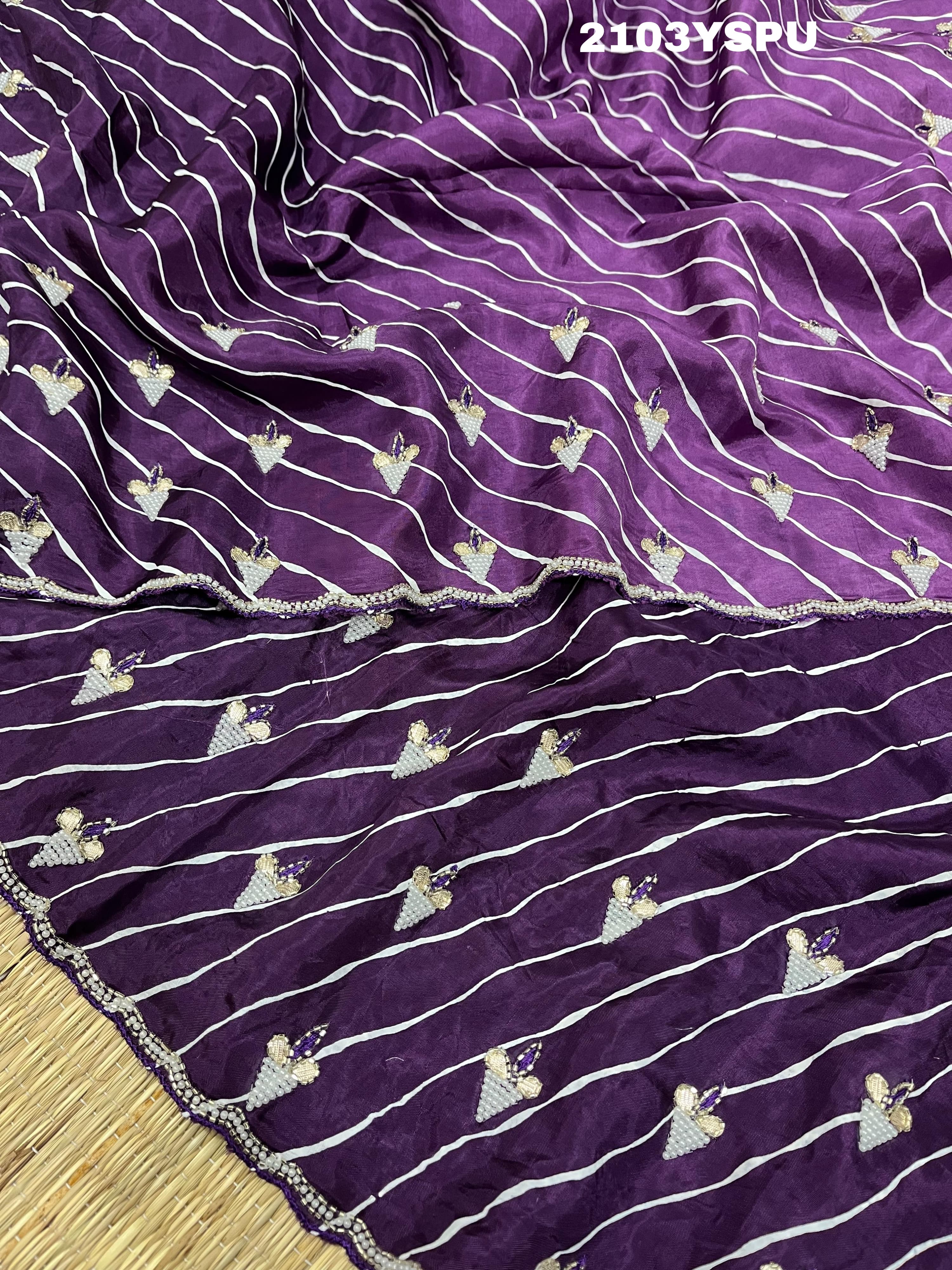 A purple dola silk saree with pearl gotapatti work