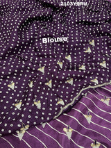 A purple dola silk saree with pearl gotapatti work