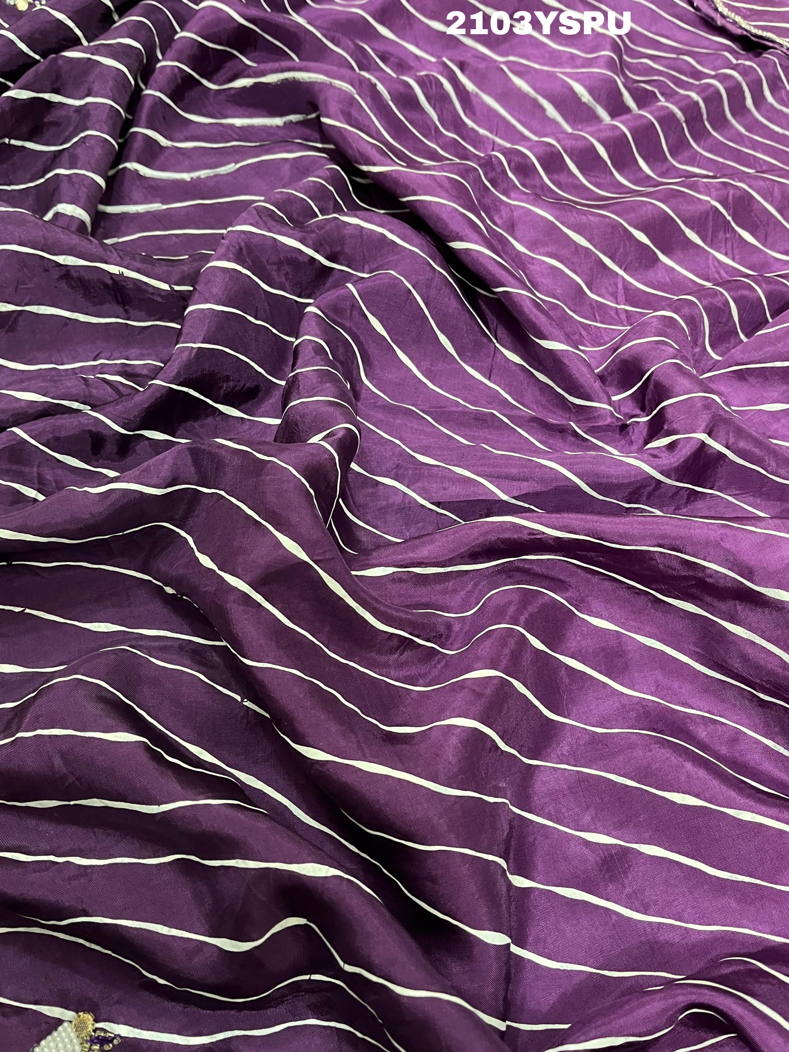 A purple dola silk saree with pearl gotapatti work