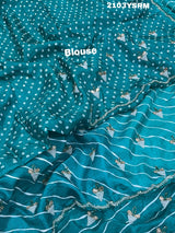 Ablue and white Dola silk saree with pearl embellishments and gota work