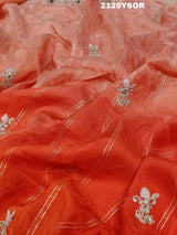 A red saree with silver and gold sequence cutdana work pattern.