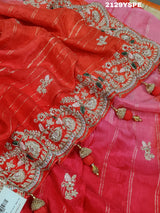 red saree with golden and silver embellishments and cutdana work, showcasing a traditional and festive design.