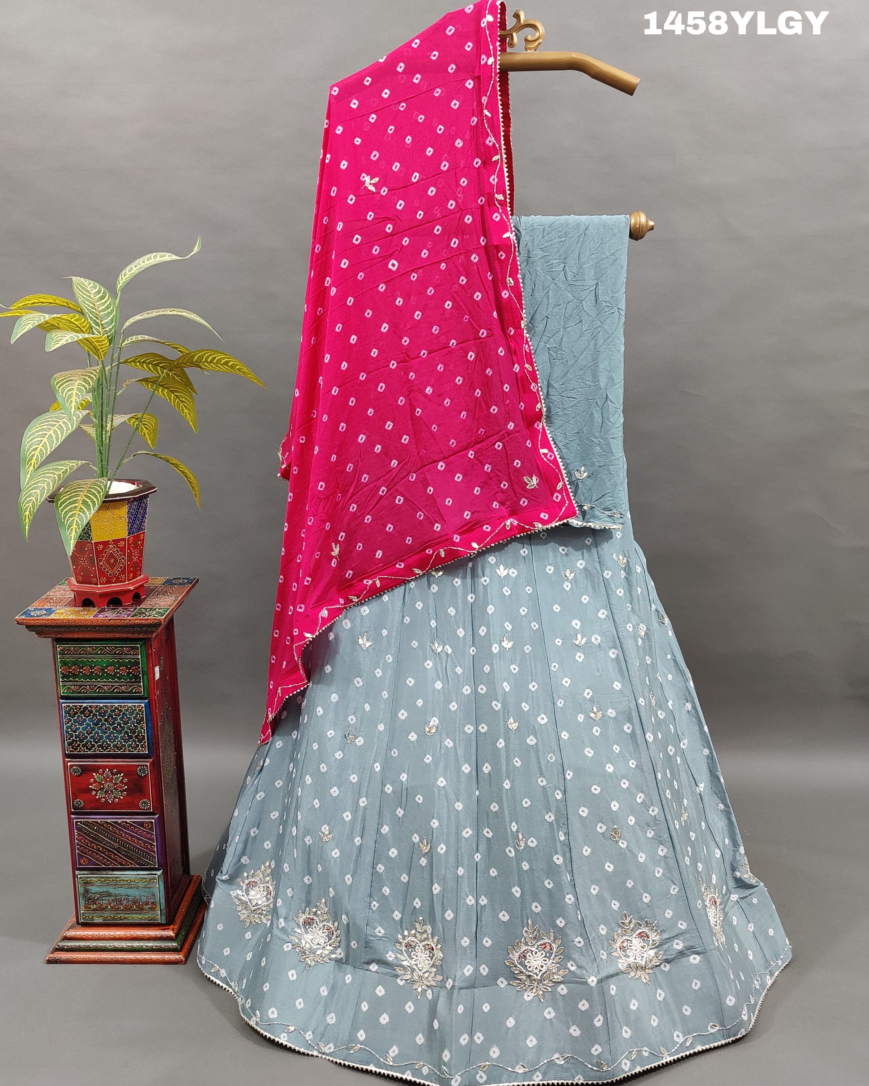 A Pure Chinon Lehenga in grey with pink Bandhani style