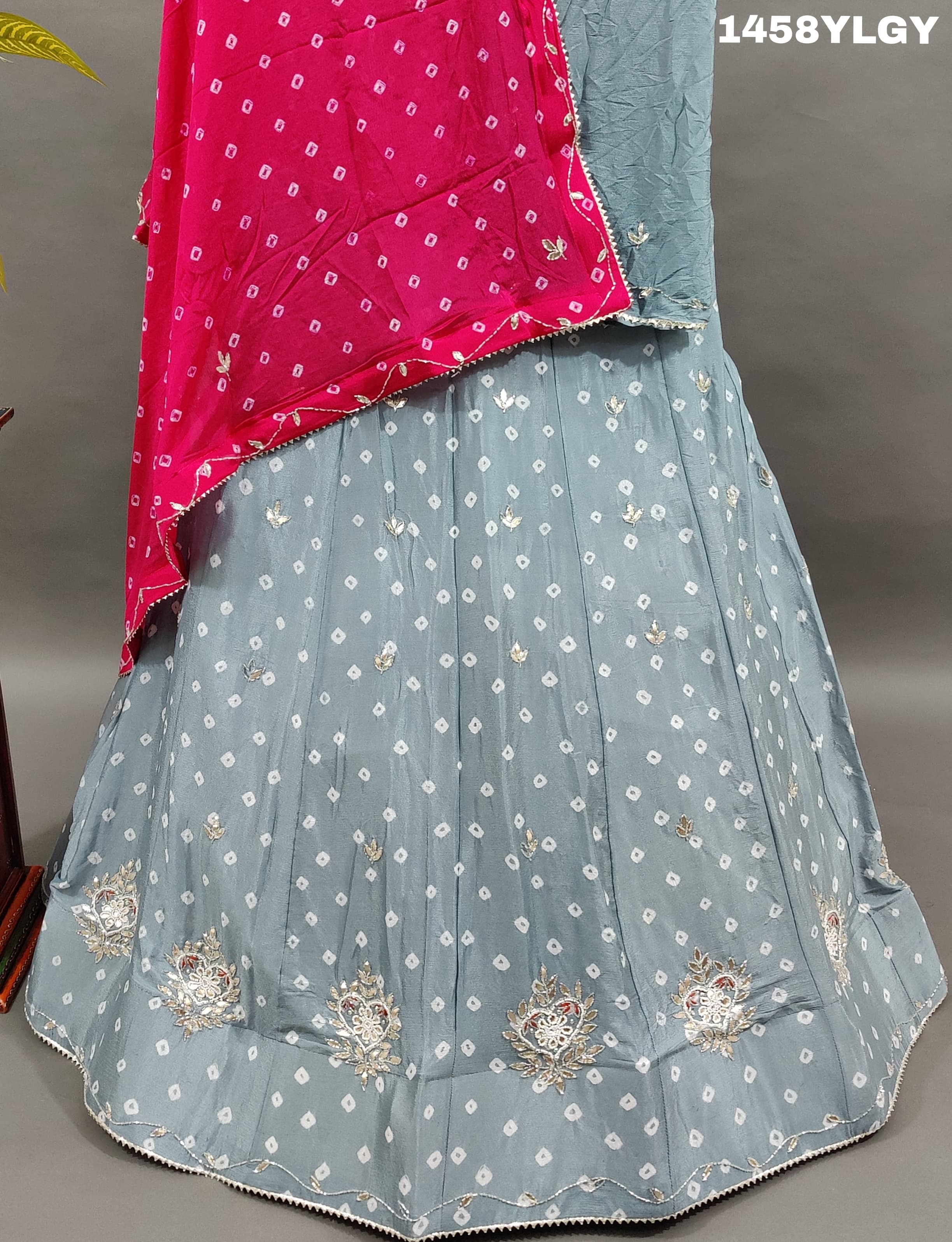 A Pure Chinon Lehenga in grey with pink Bandhani style