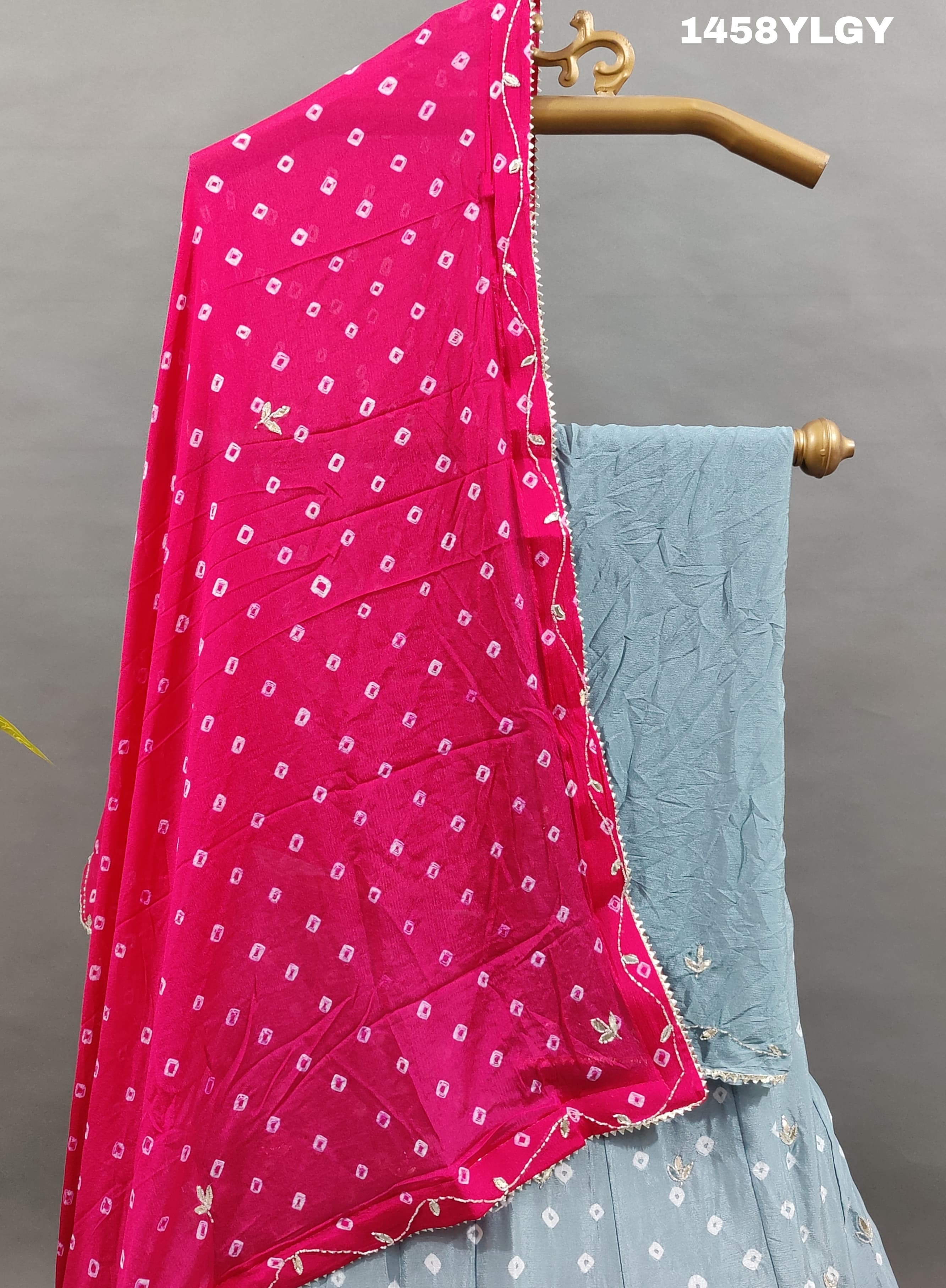 A Pure Chinon Lehenga in grey with pink Bandhani style