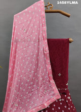 A traditional wear lehenga in maroon color with bandhani style