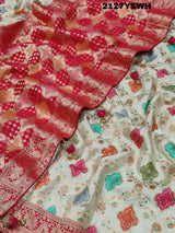 A Banarasi silk saree with a Meenakari pattern featuring a cream body with multicolor floral designs and a red border.