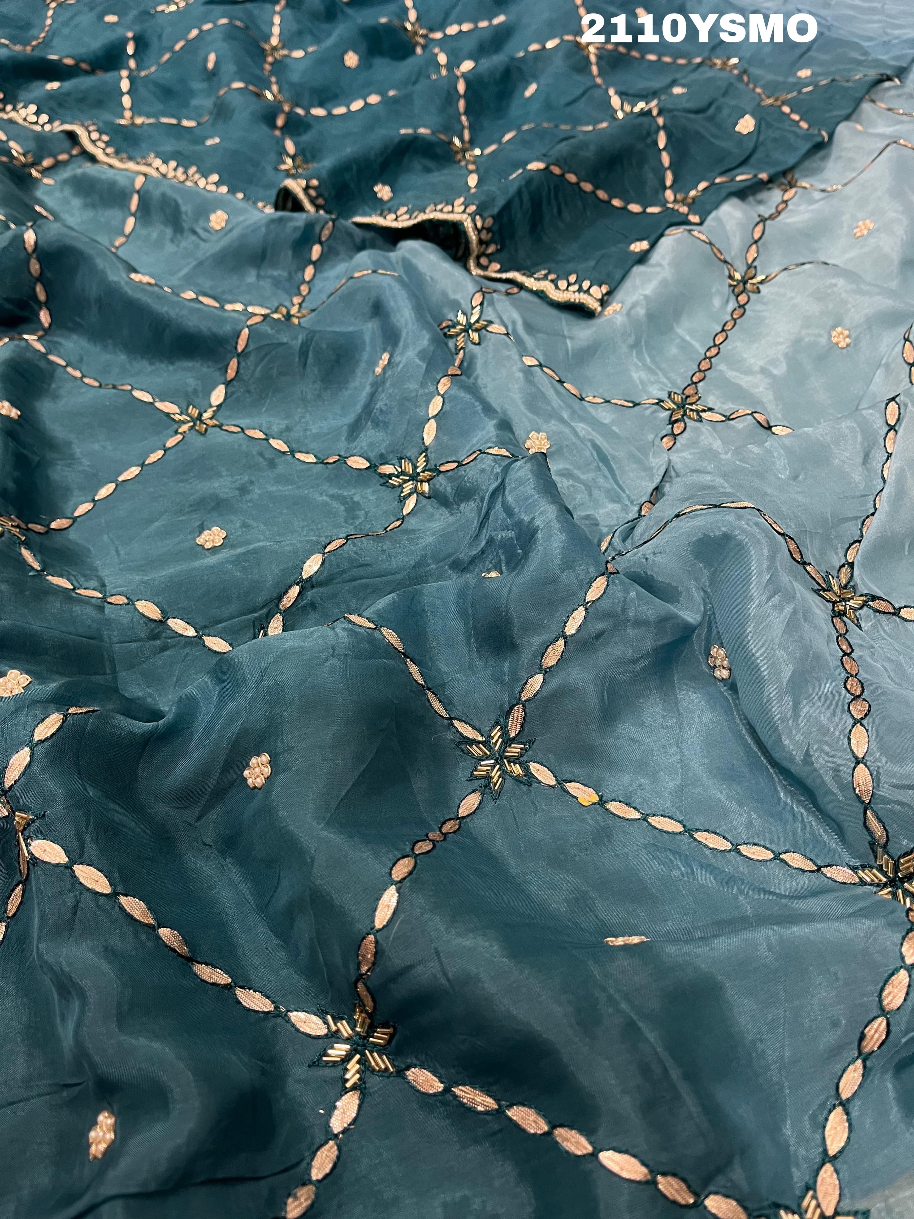 A blue saree with geometric gotapatti work embroidery