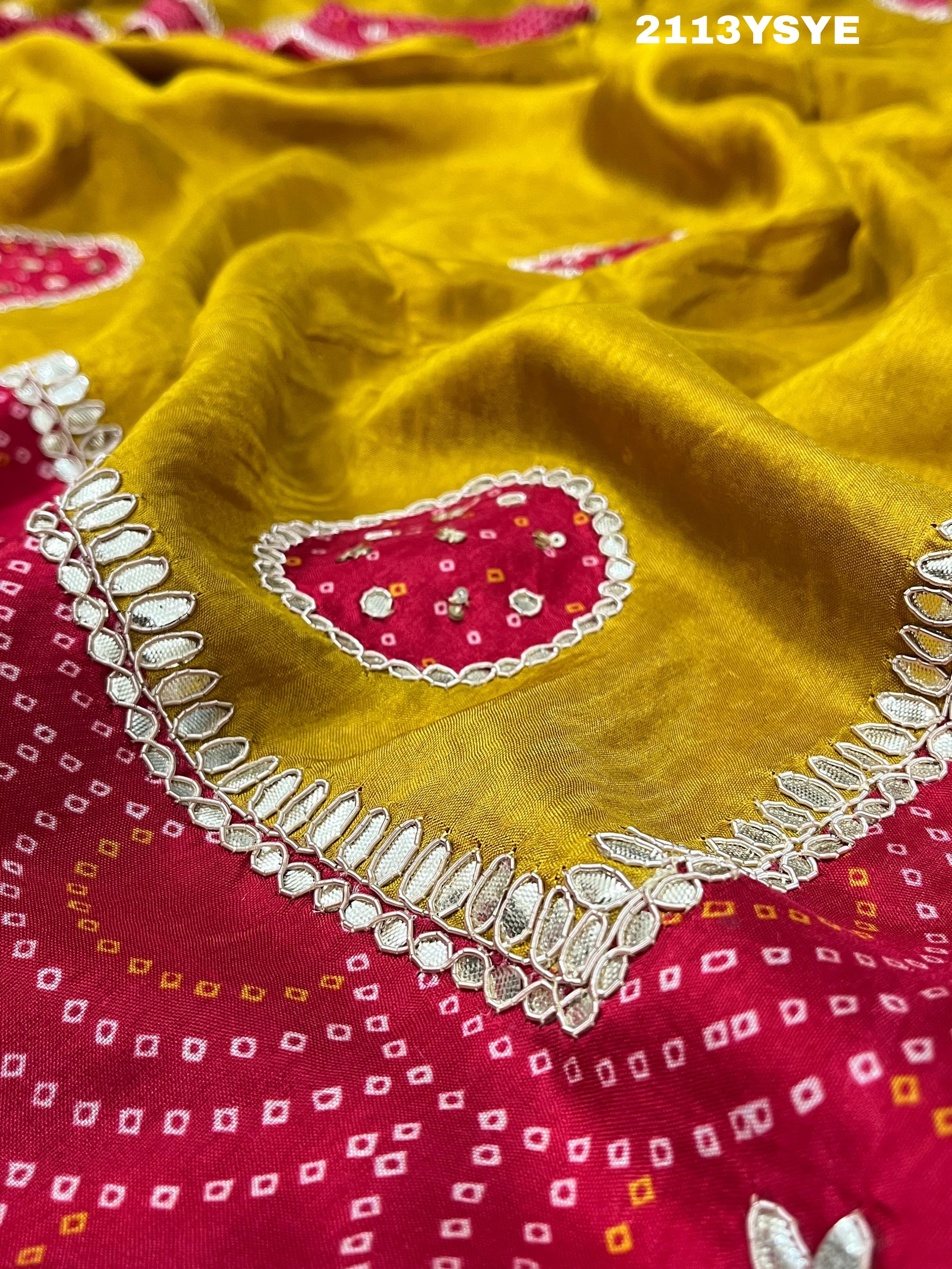 A yellow and red bandhani style dola silk saree with gota patti work