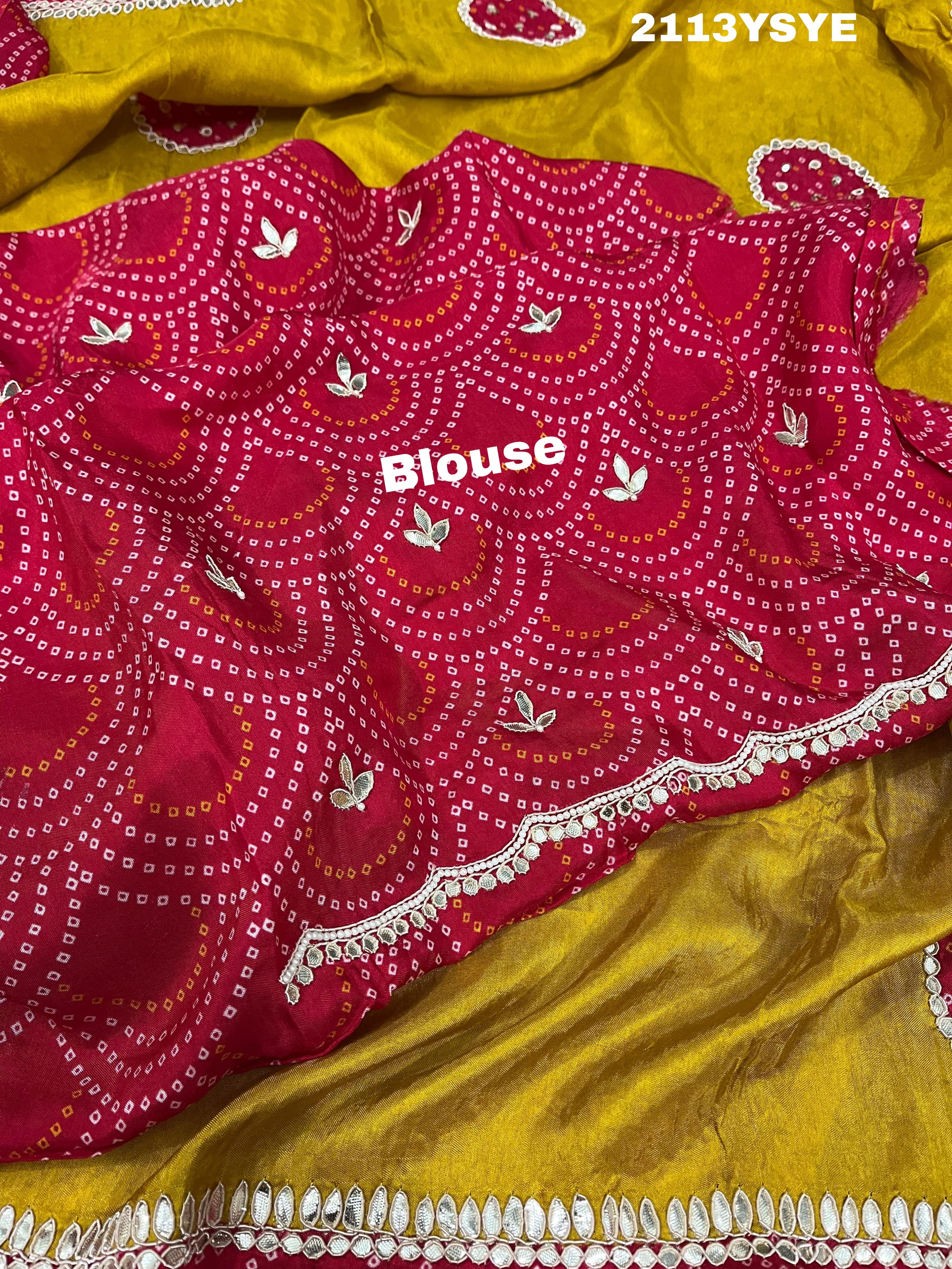 A yellow and red bandhani style dola silk saree with gota patti work