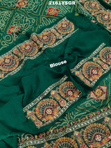 A green saree with red bandhej patterns and royal aari work, along with real mirror work on the border.