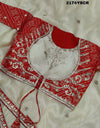 A red and white tissue silk saree with Bollywood style embellishments and gotapatti work.