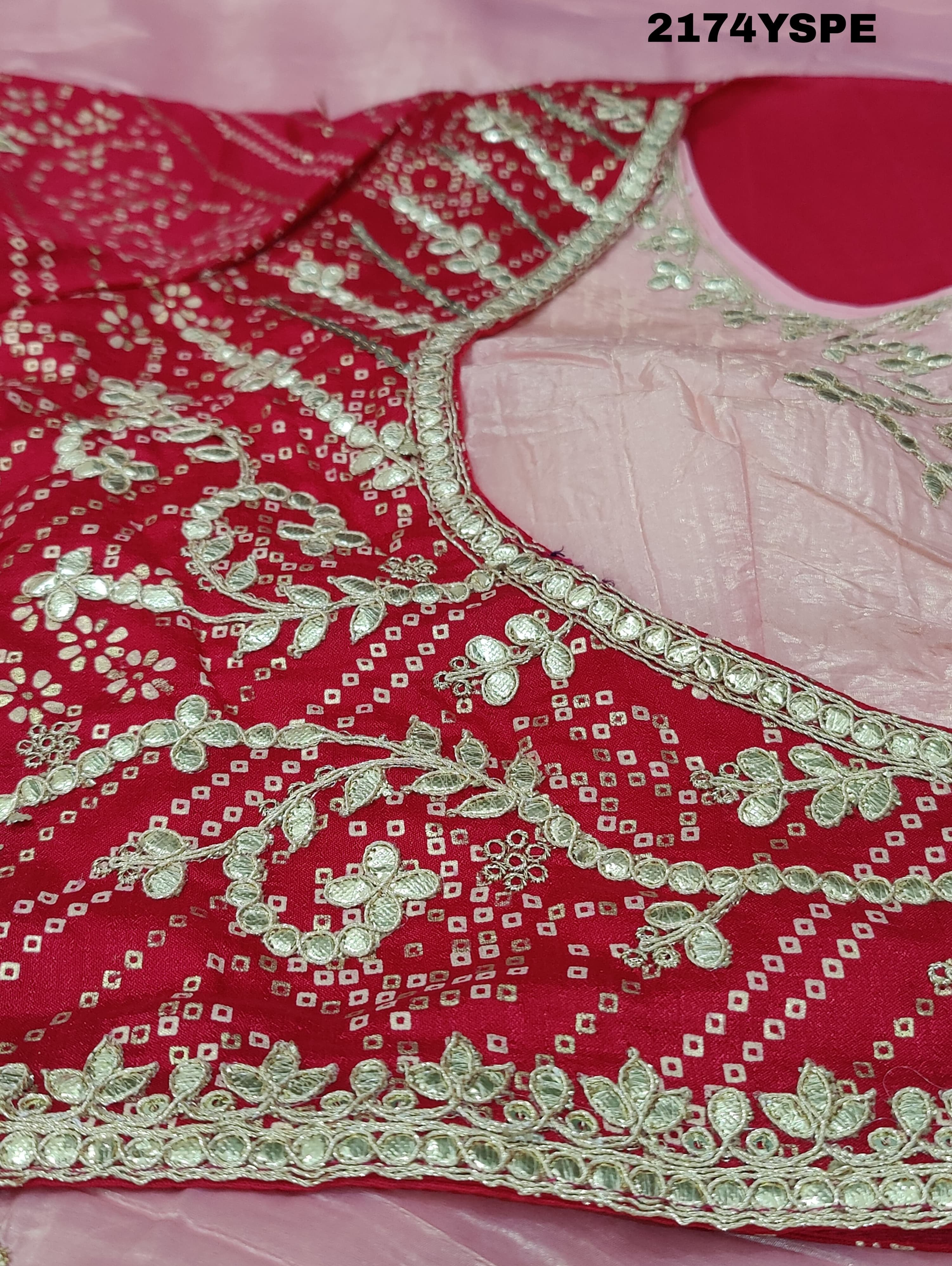 A saree with tissue silk fabric featuring Bollywood style embellishments and gotapatti work in red and pink colour