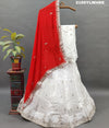 A traditional wear lehenga in white with gotapatti work
