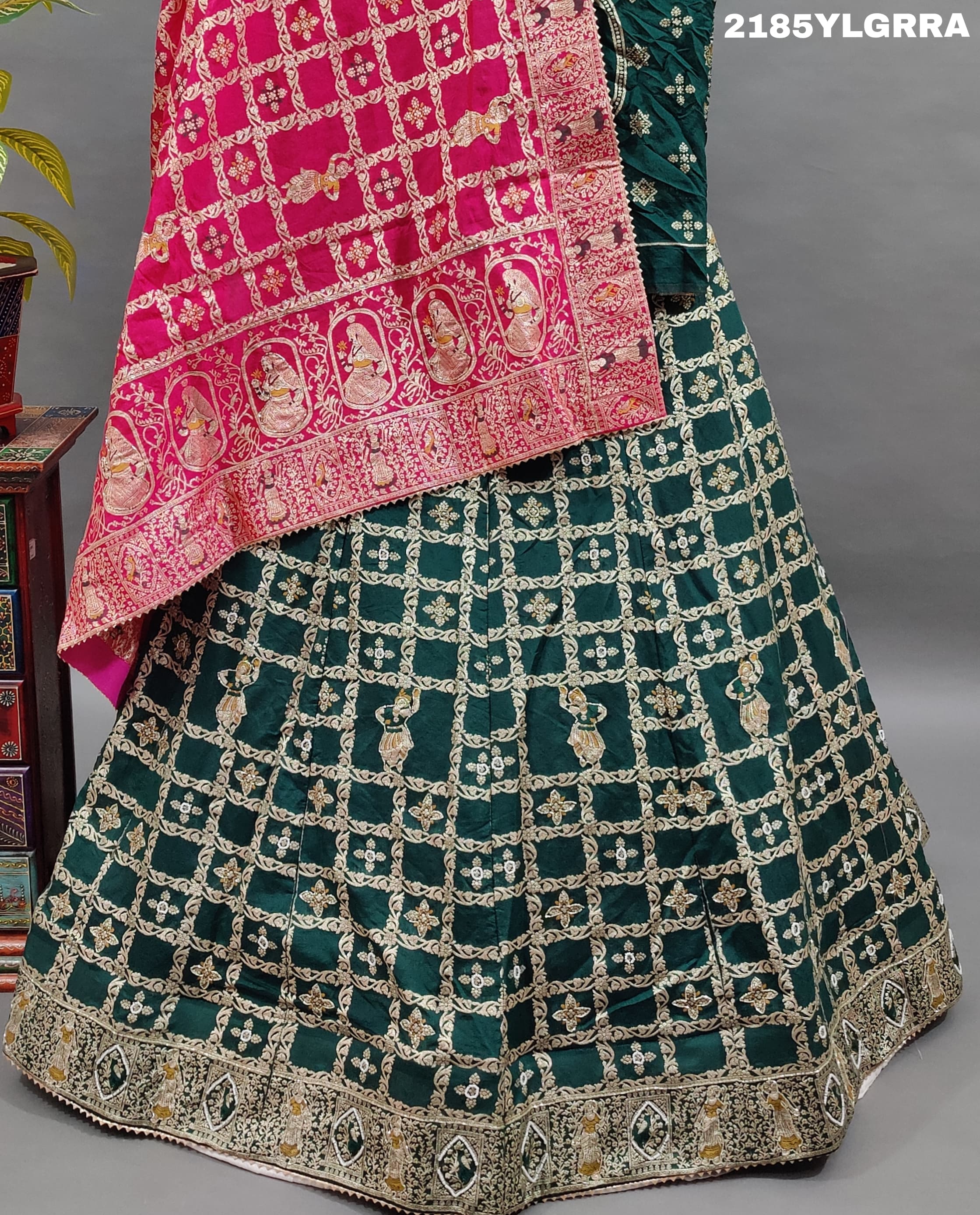 A traditional wear lehenga with Dola Silk Banarasi style embellished with white beads