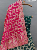 A traditional wear lehenga with Dola Silk Banarasi style embellished with white beads