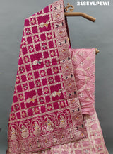 A Lehenga with Banarasi style pattern and white bead work in a traditional design.