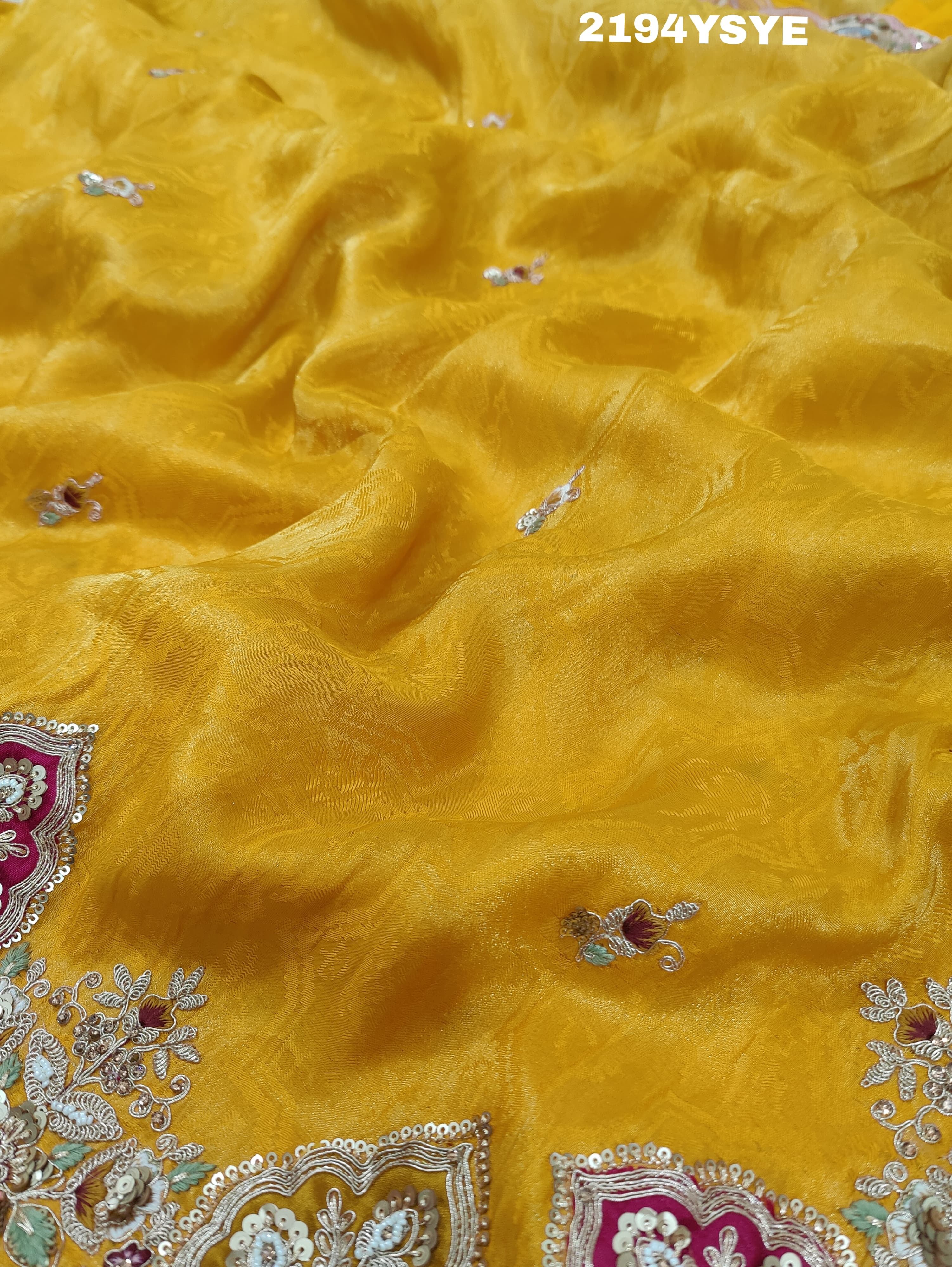 Yellow Banarasi silk saree with floral embroidery work