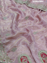 A pink tissue silk saree with traditional sequence Gotapatti work.
