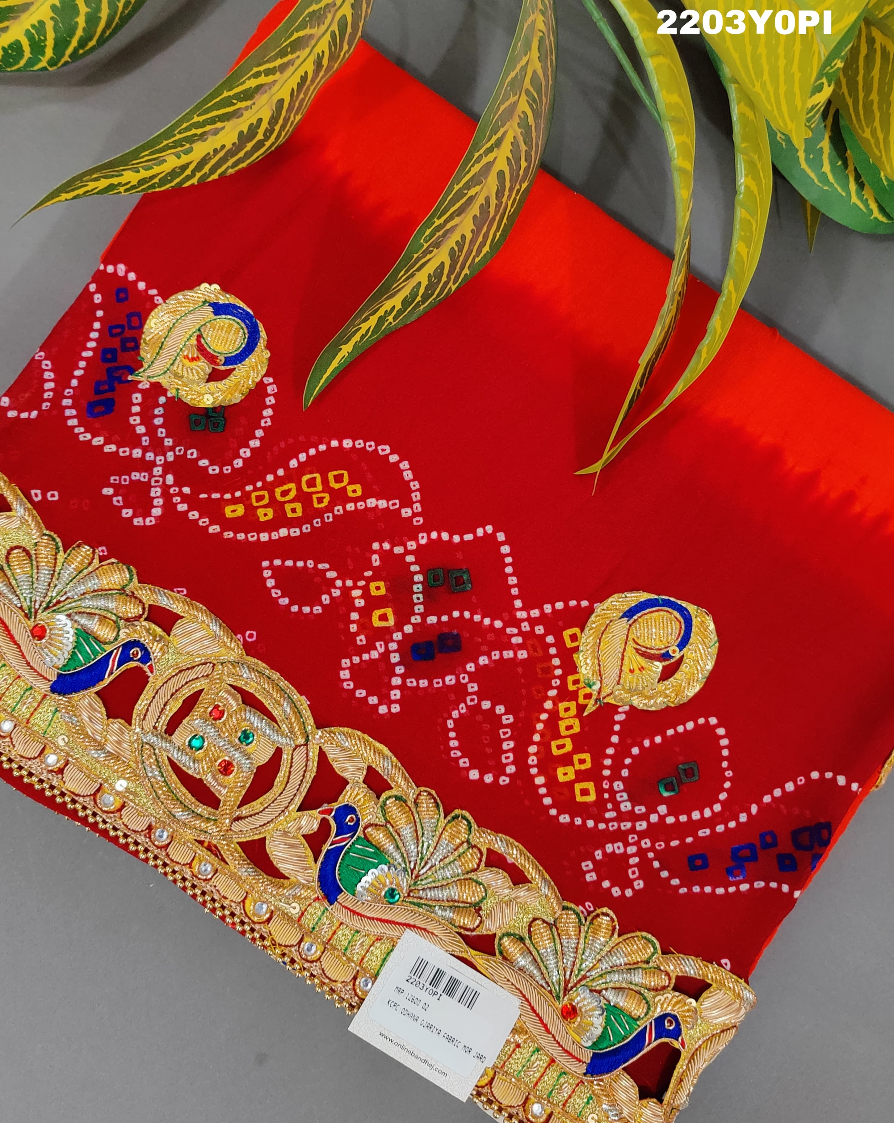 A red and orange Marwadi chunri Pure Ojariya Bel Buti Odhna