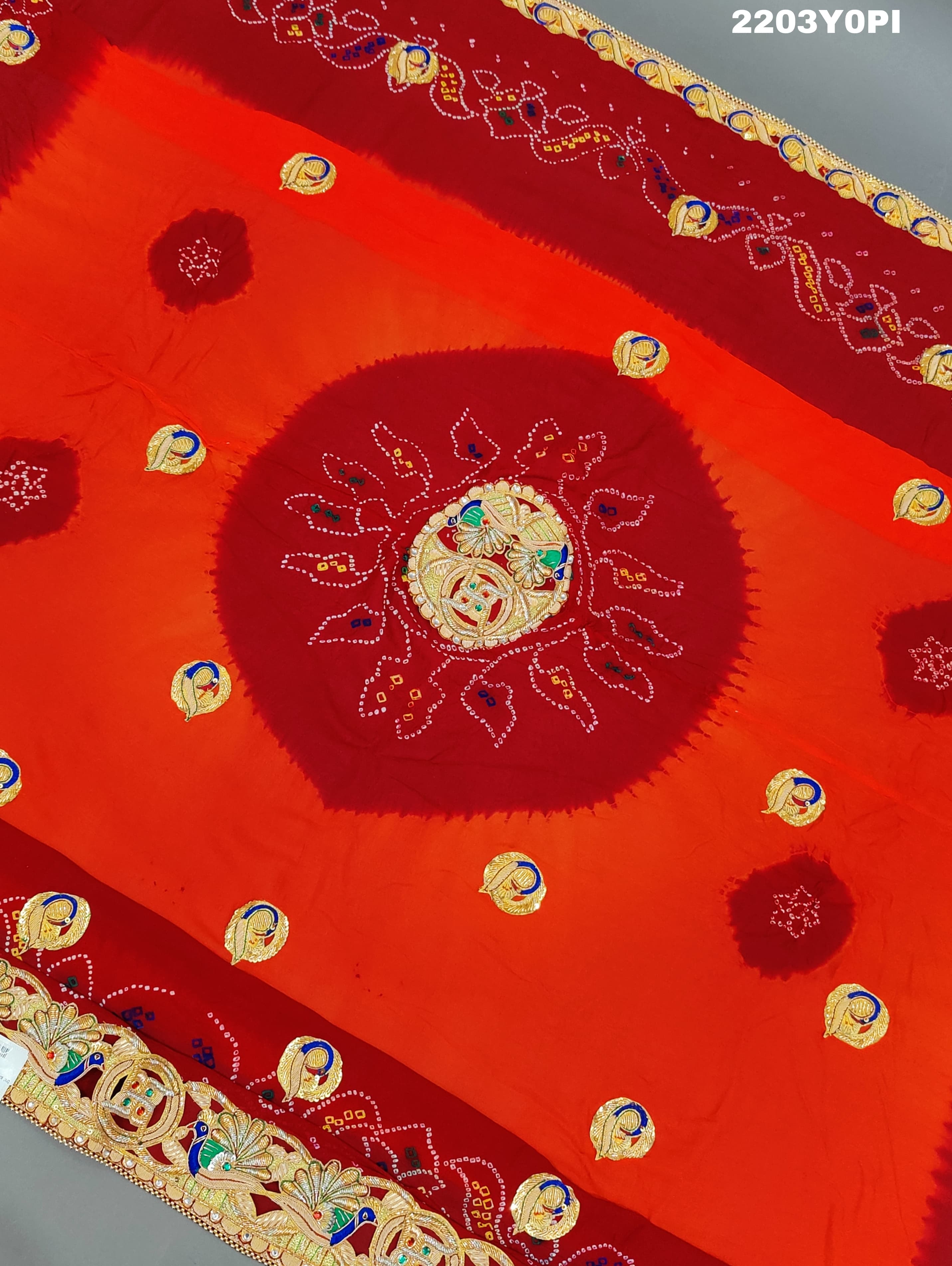 A red and orange Marwadi chunri Pure Ojariya Bel Buti Odhna