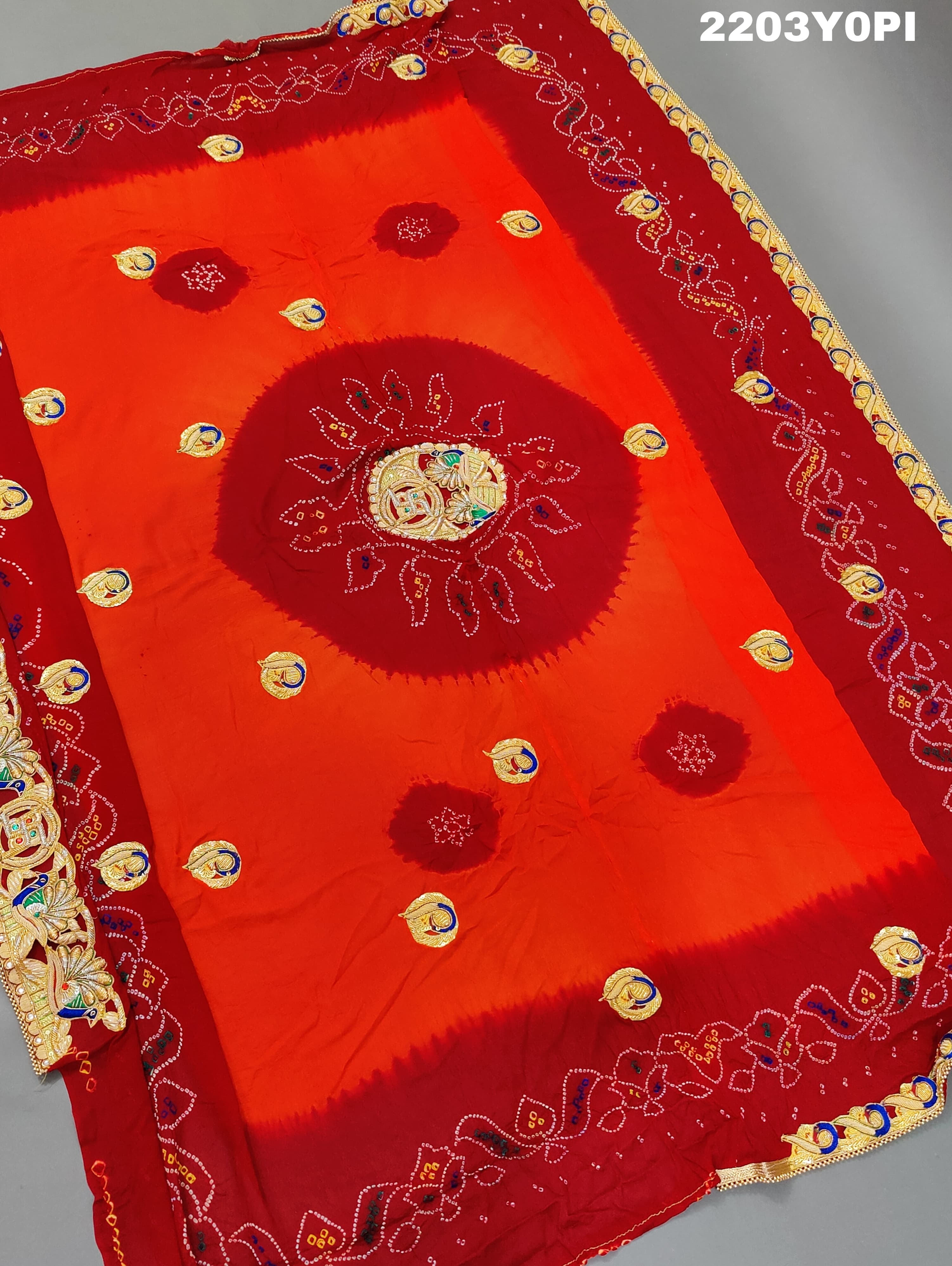 A red and orange Marwadi chunri Pure Ojariya Bel Buti Odhna