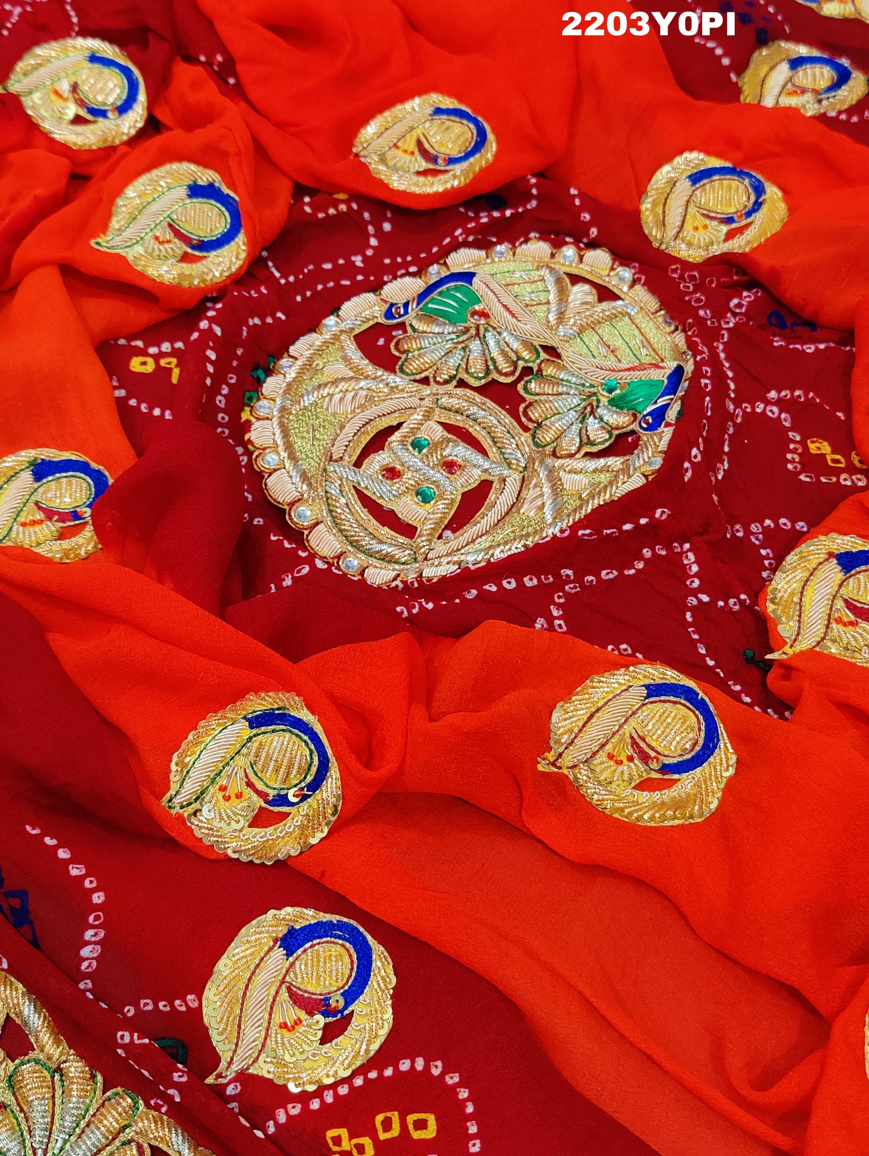 A red and orange Marwadi chunri Pure Ojariya Bel Buti Odhna