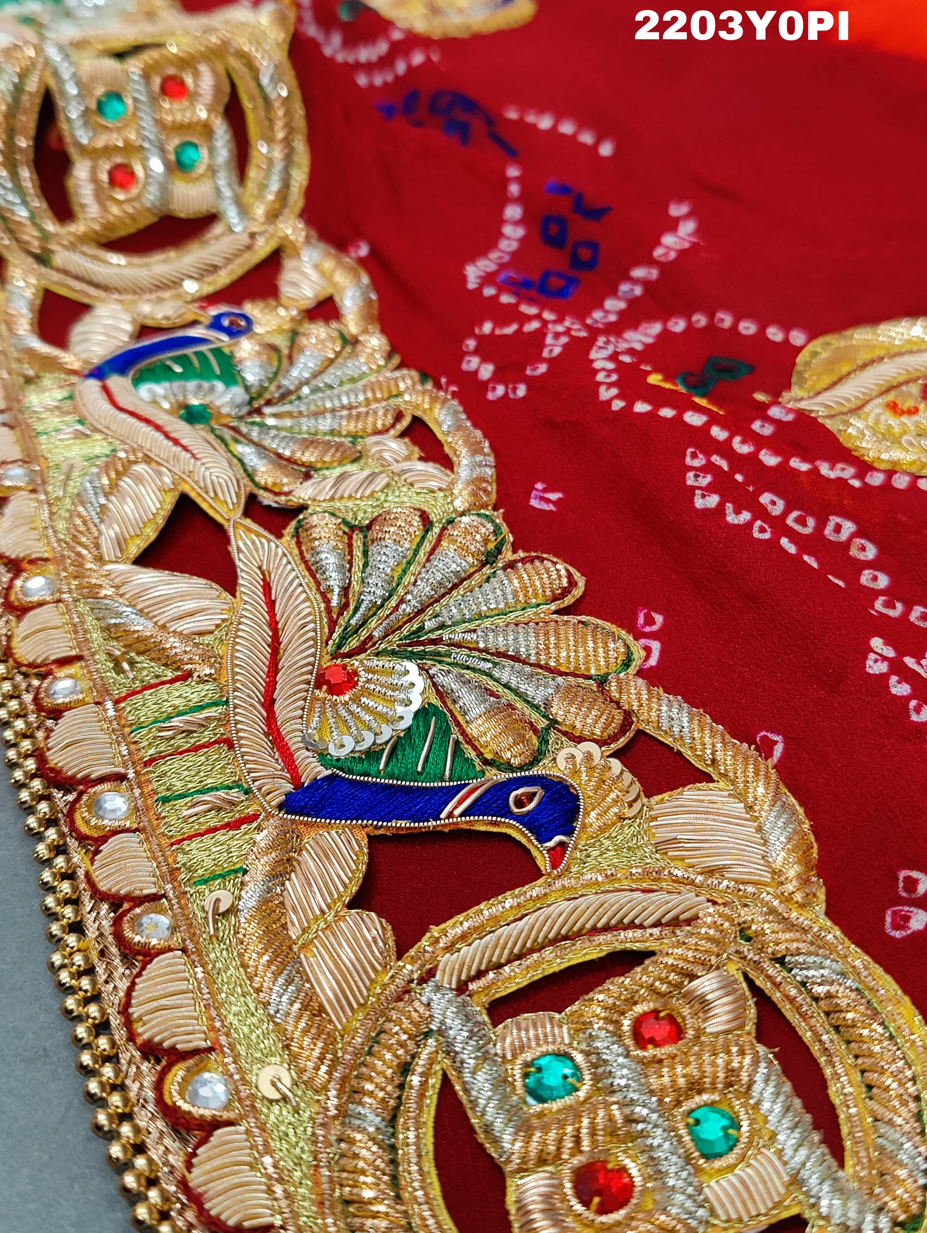 A red and orange Marwadi chunri Pure Ojariya Bel Buti Odhna