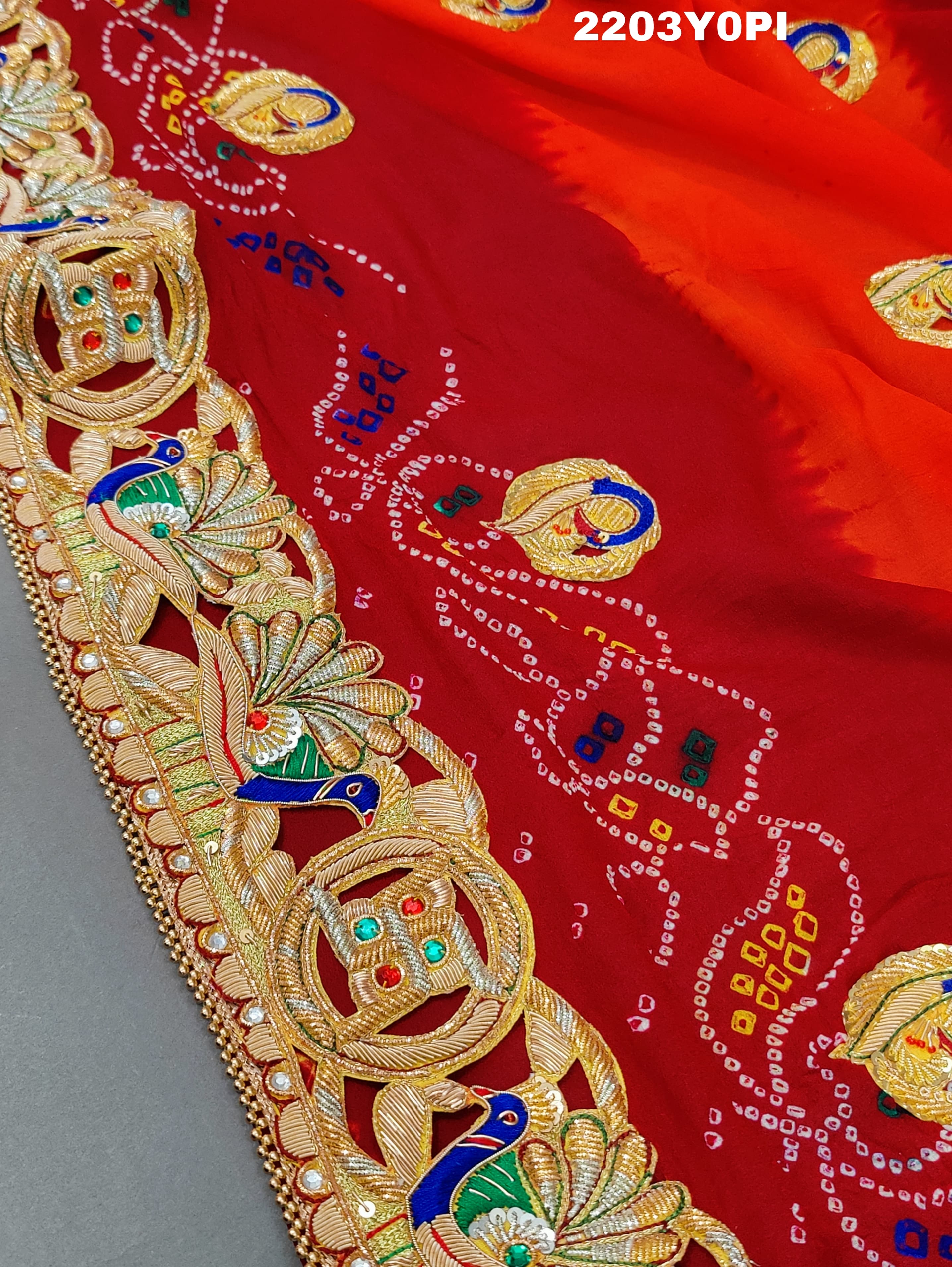 A red and orange Marwadi chunri Pure Ojariya Bel Buti Odhna