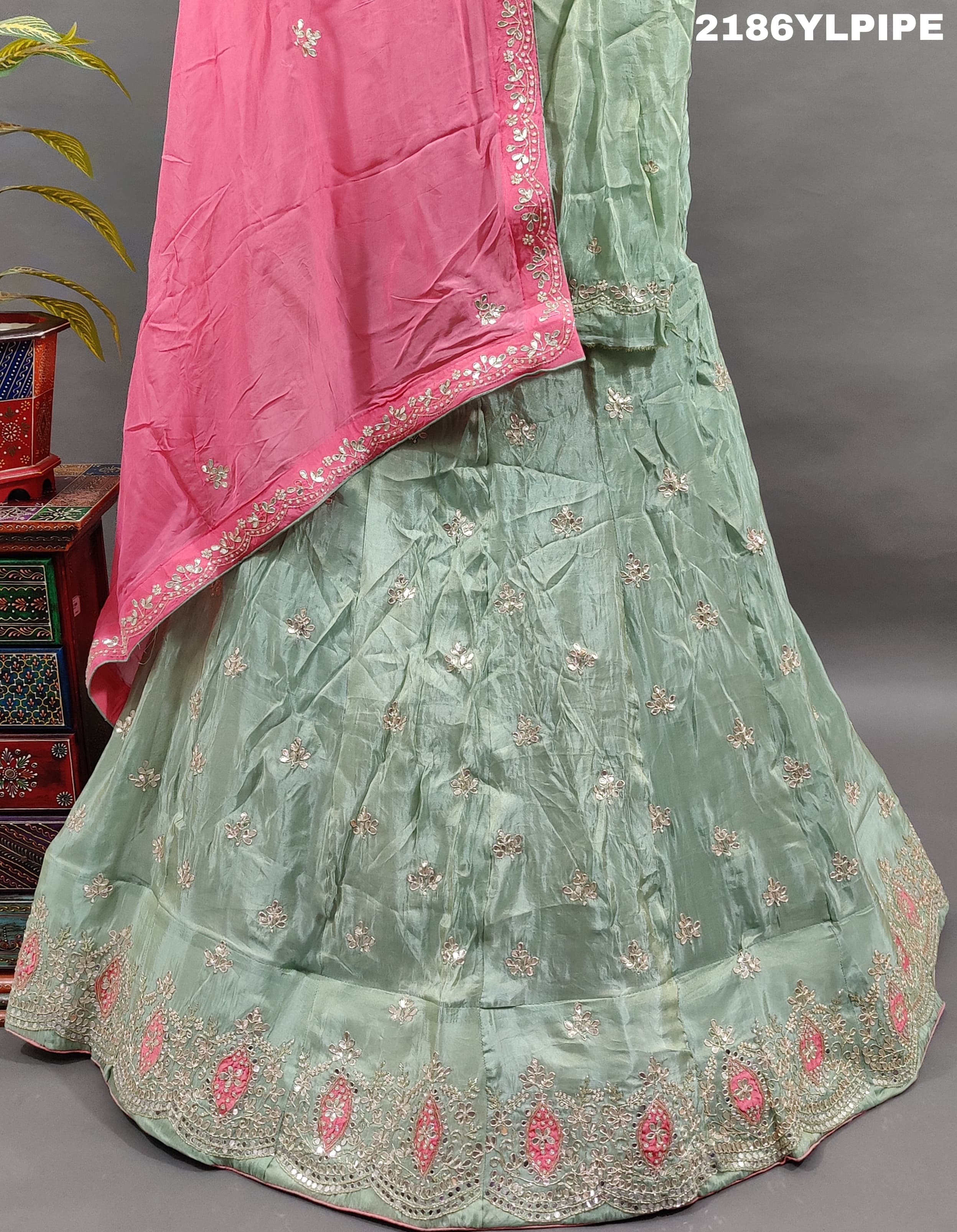 A traditional Indian lehenga with cutdana and gotapatti work.