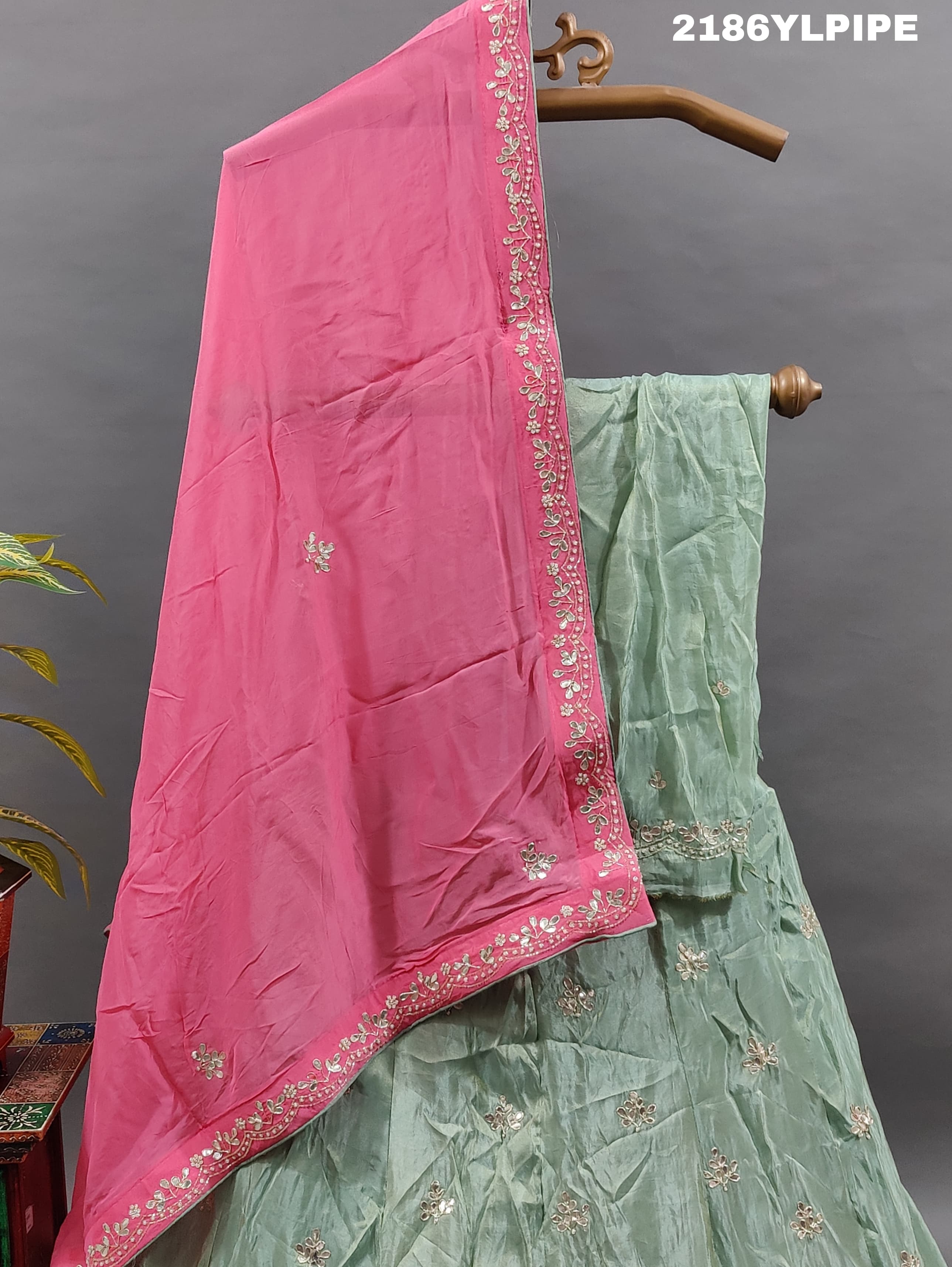 A traditional Indian lehenga with cutdana and gotapatti work.