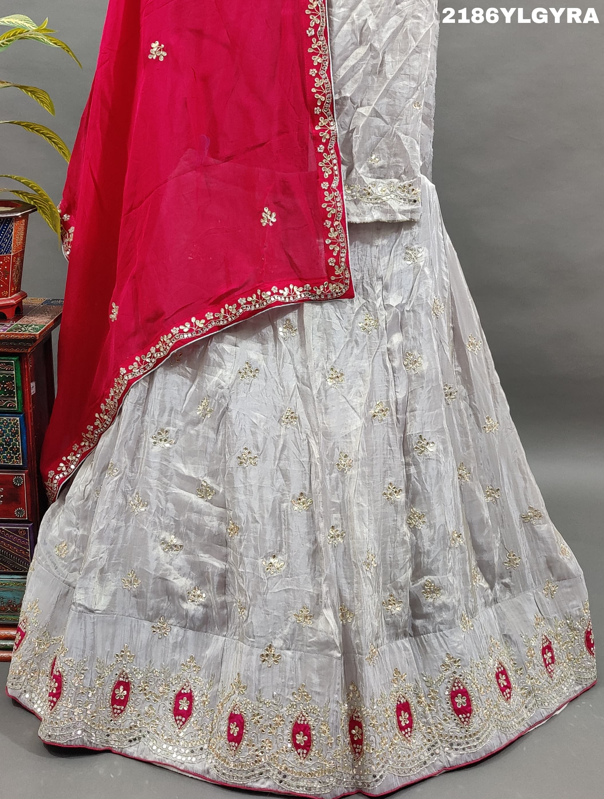 A Bollywood style Upada silk lehenga with cutdana and gotapatti work