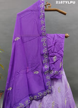 A traditional style purple lehenga with white bead work