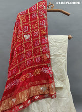 A traditional Indian lehenga with bandhani style and cutdana gotapatti work
