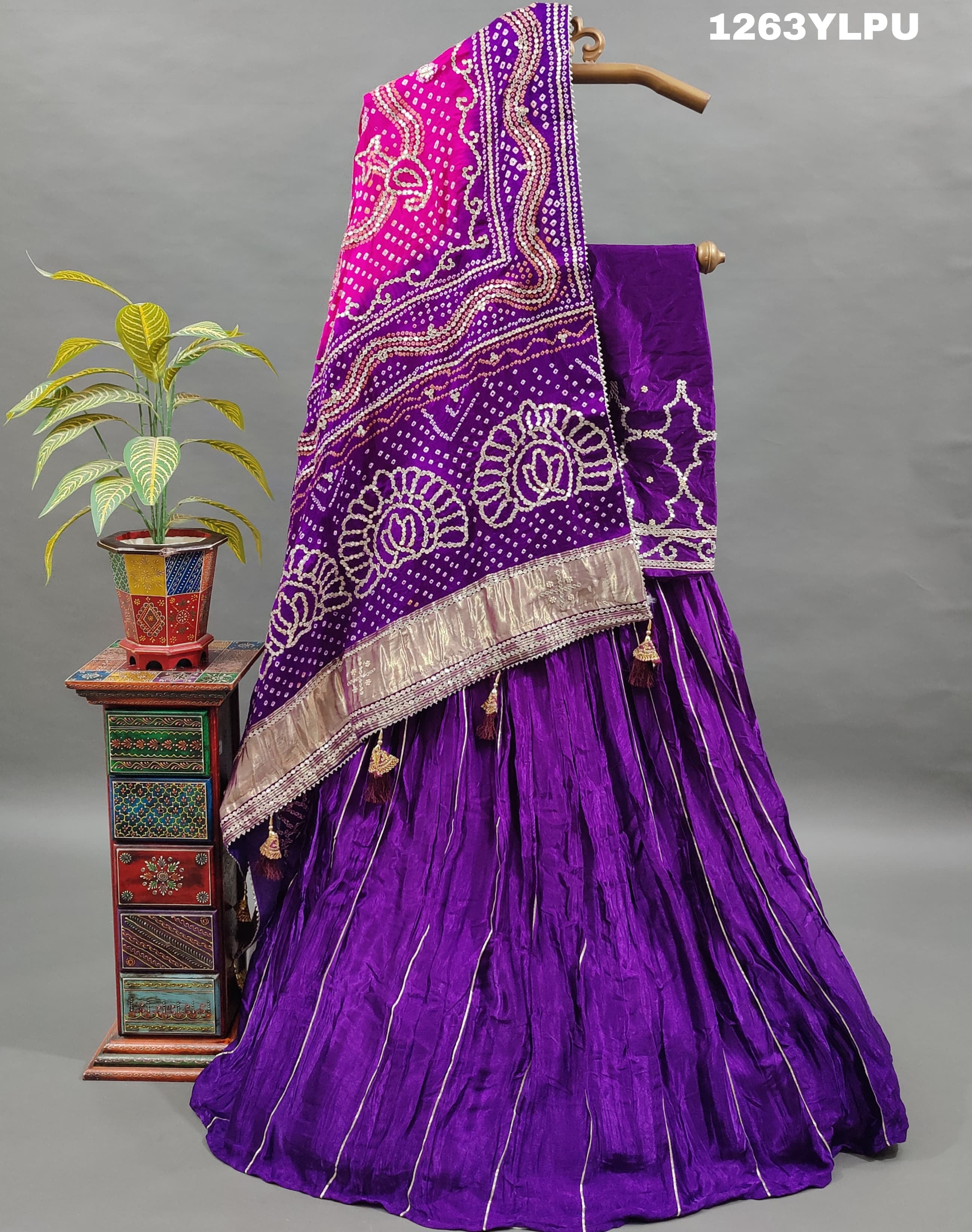 A traditional wear lehenga with bandhani style gotapatti work