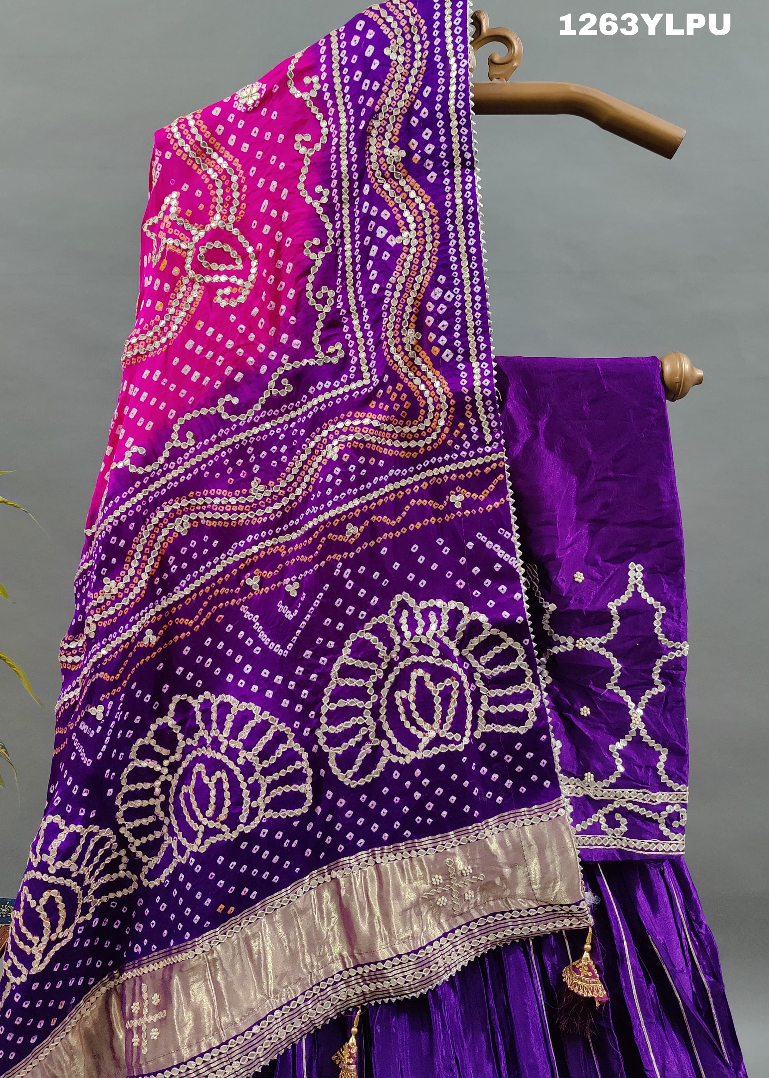 A traditional wear lehenga with bandhani style gotapatti work