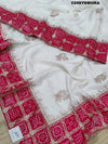 Munga Silk saree with Bandhani style embellishments and Gotapatti work, predominantly pink and white.