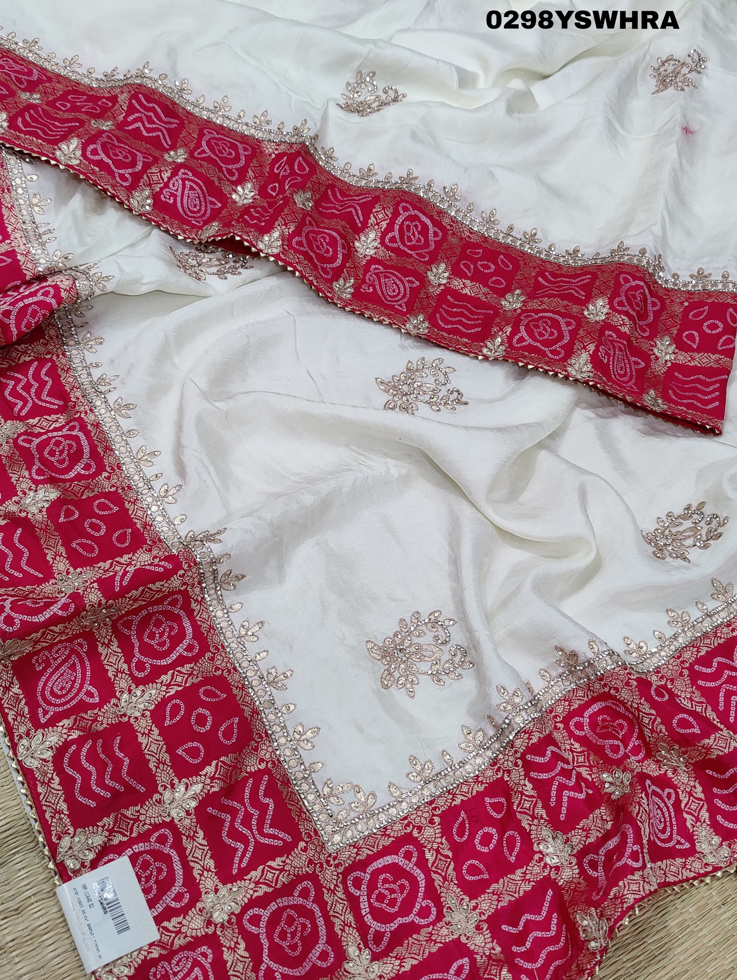 Munga Silk saree with Bandhani style embellishments and Gotapatti work, predominantly pink and white.