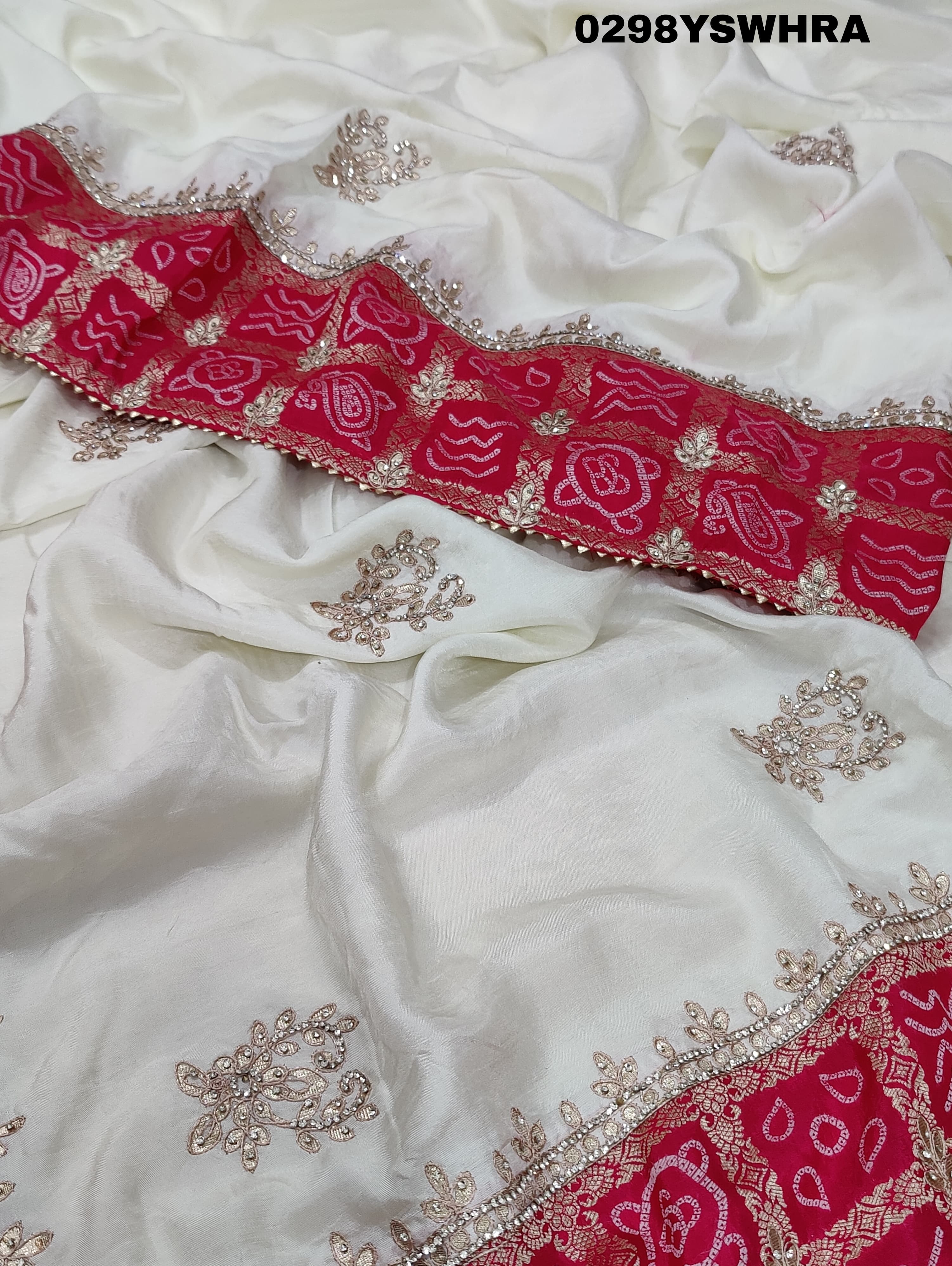 Munga Silk saree with Bandhani style embellishments and Gotapatti work, predominantly pink and white.