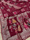 A wine colored Dola Silk saree with Banarasi style stone work, depicting traditional Indian motifs and characters.
