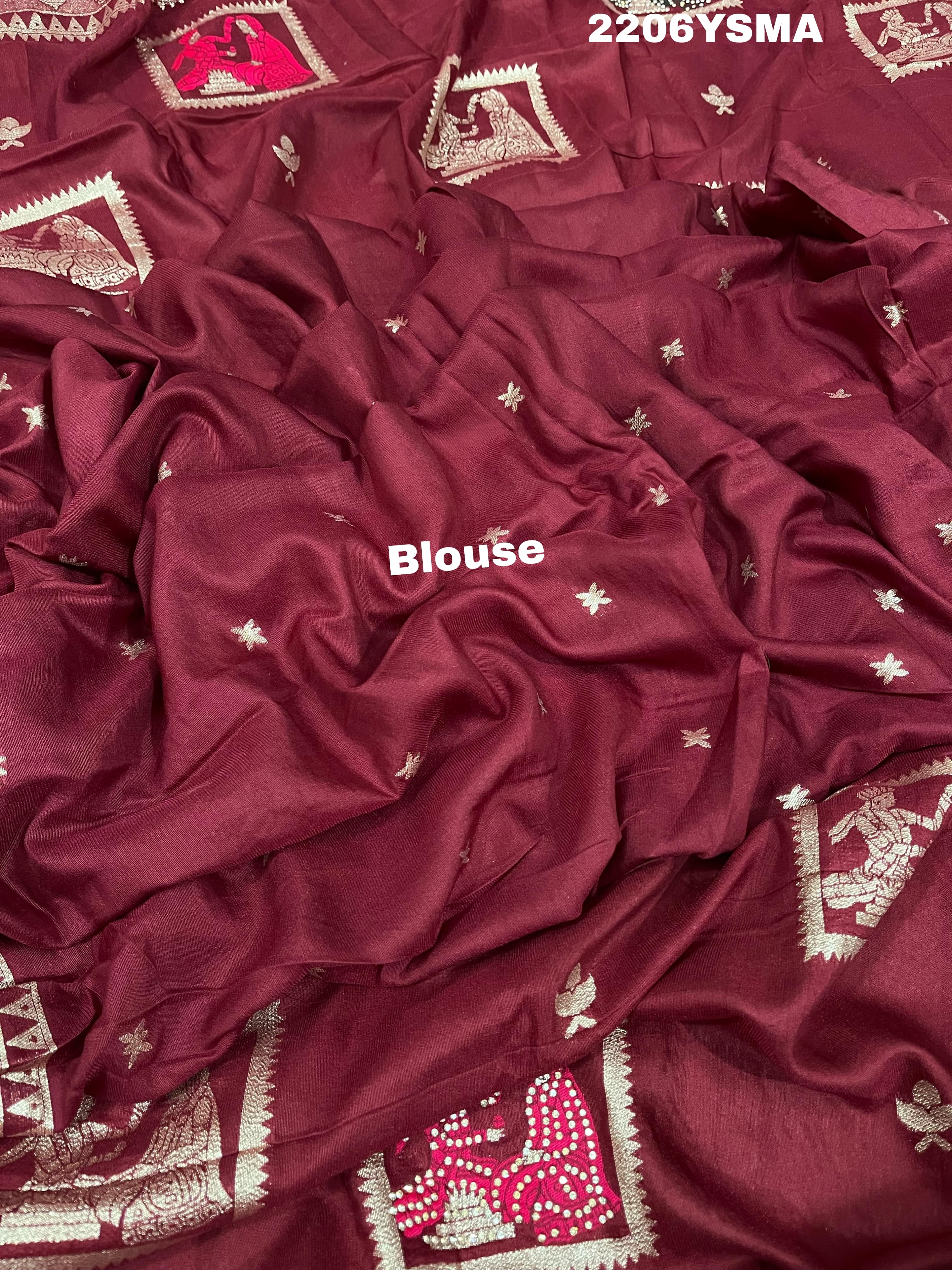 A wine colored Dola Silk saree with Banarasi style stone work, depicting traditional Indian motifs and characters.