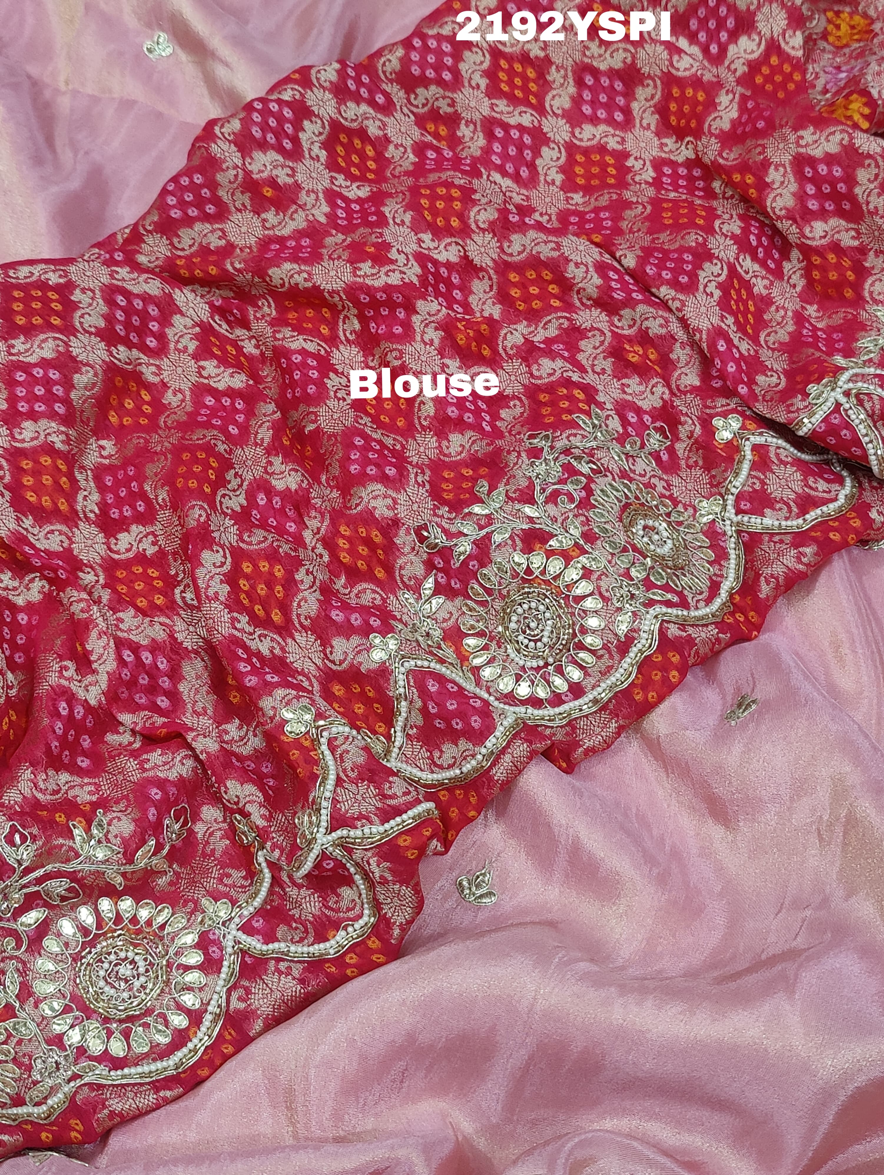 A pink Chinon silk saree with white and silver cutdana bead work and traditional border design.