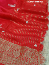 A red and gold Banarasi style silk saree with zardozi work,