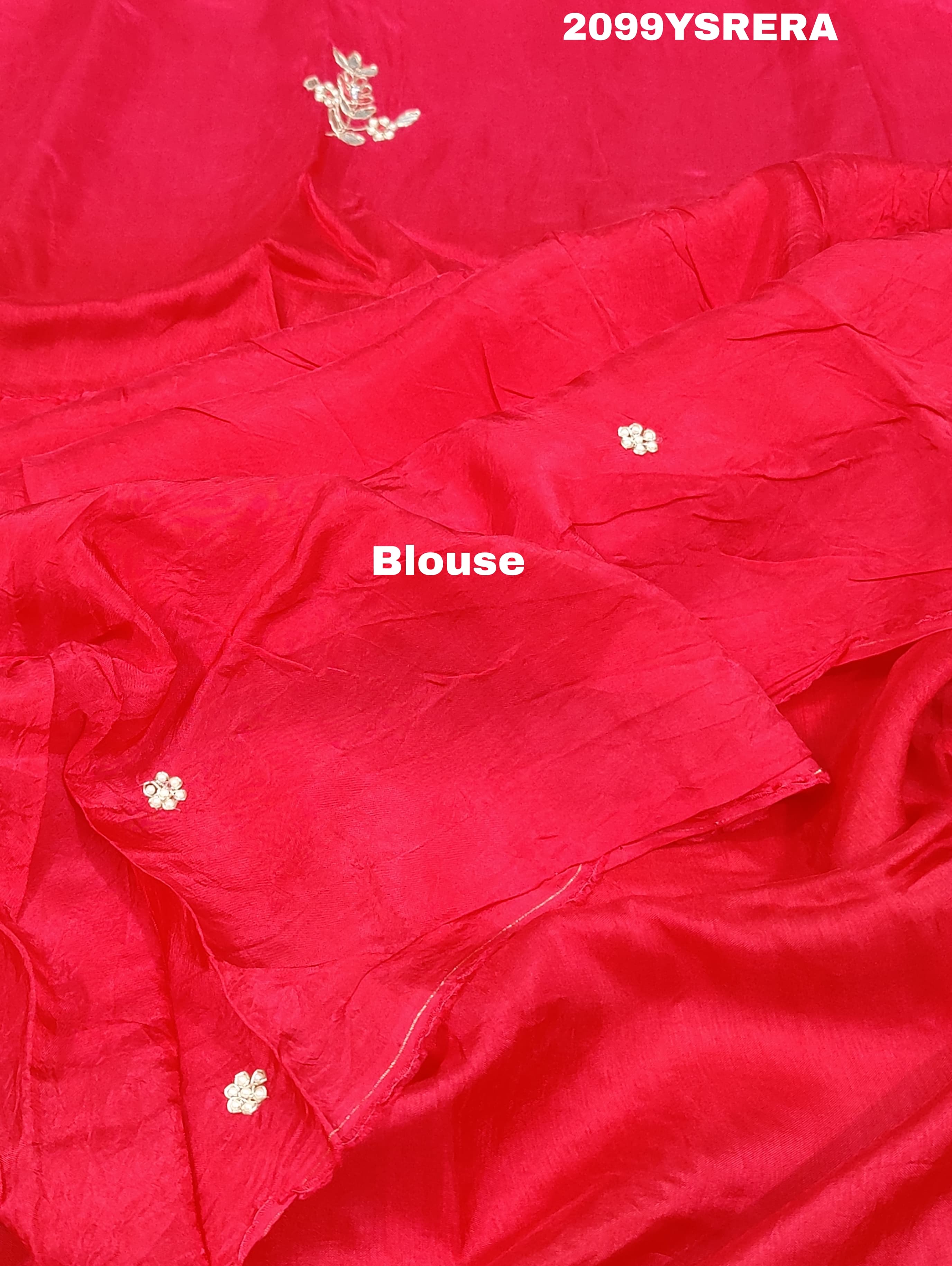 A red and gold Banarasi style silk saree with zardozi work,