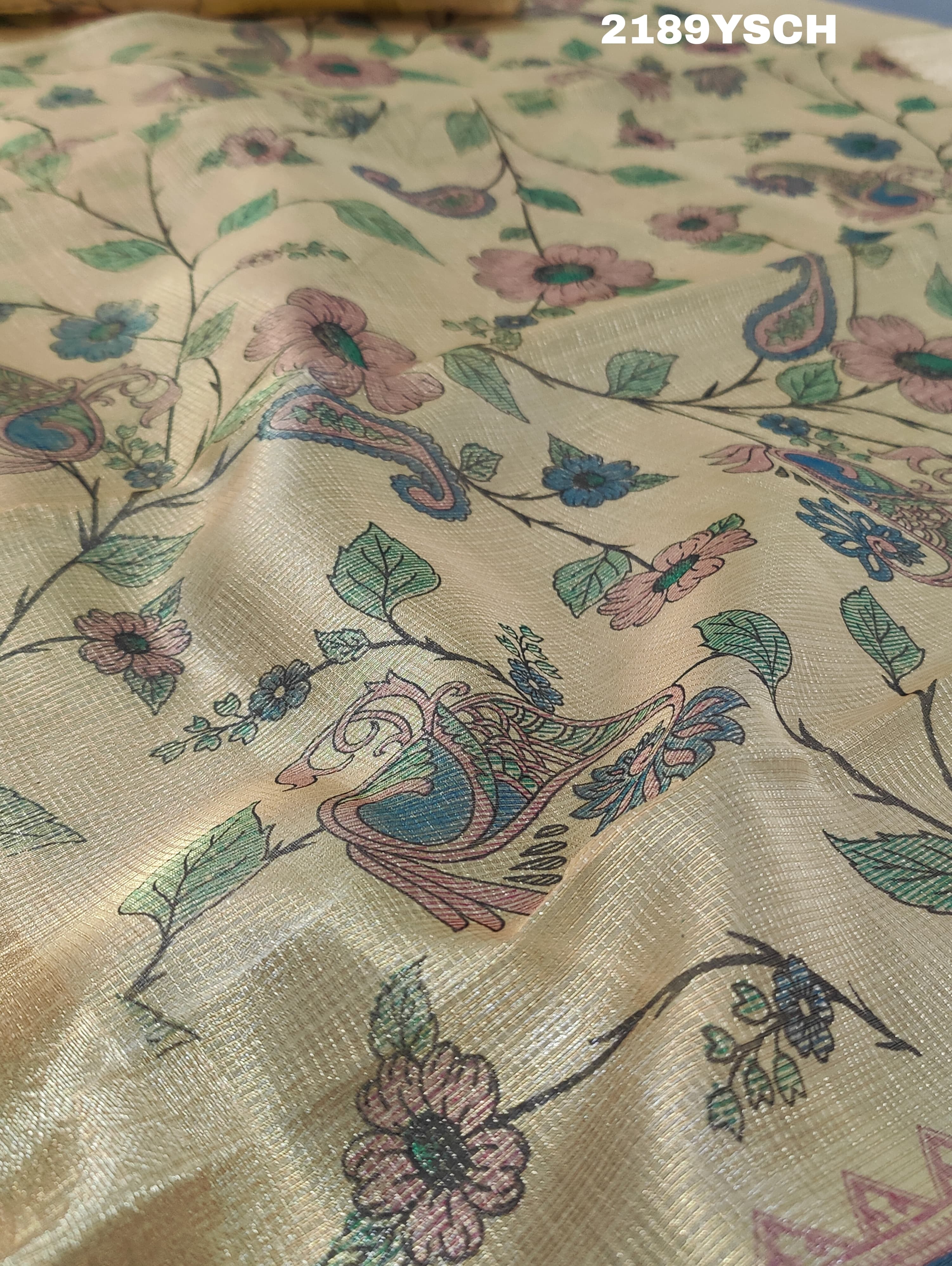 A yellow and blue floral patterned Tussar silk saree with Banarasi weaving.