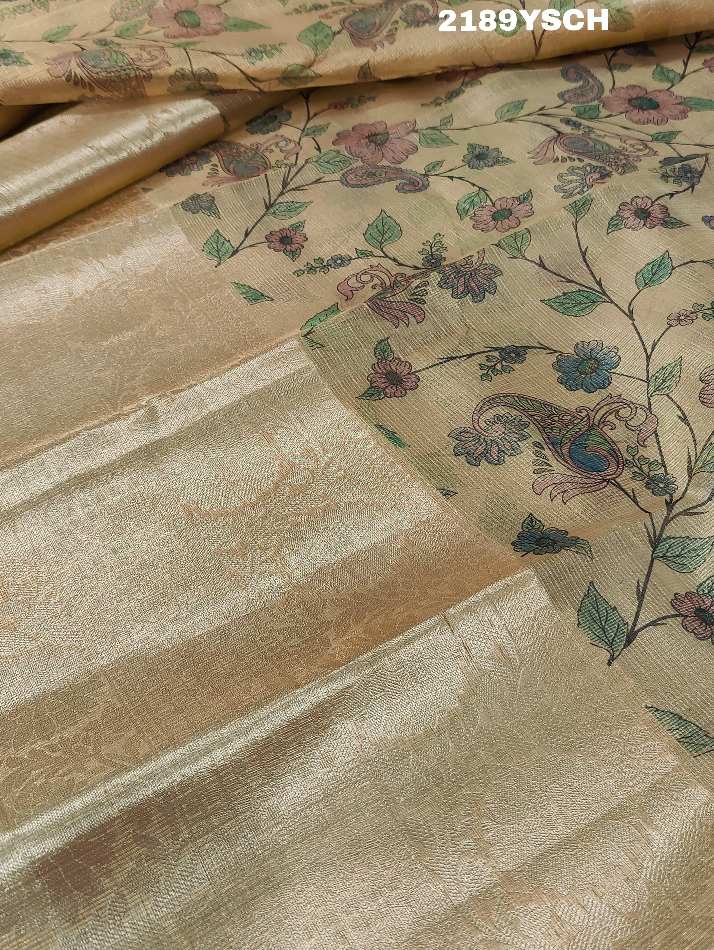 A yellow and blue floral patterned Tussar silk saree with Banarasi weaving.