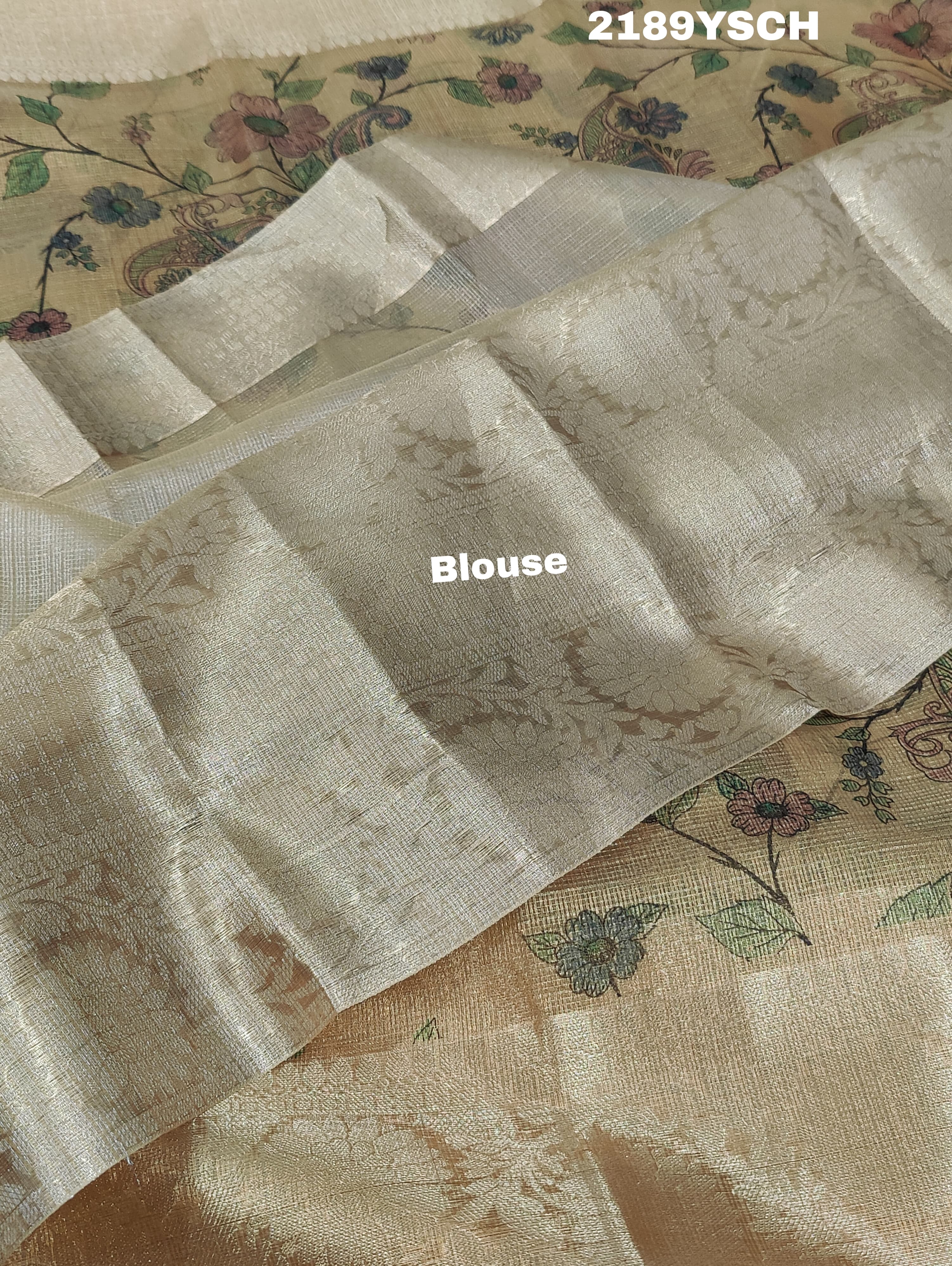 A yellow and blue floral patterned Tussar silk saree with Banarasi weaving.