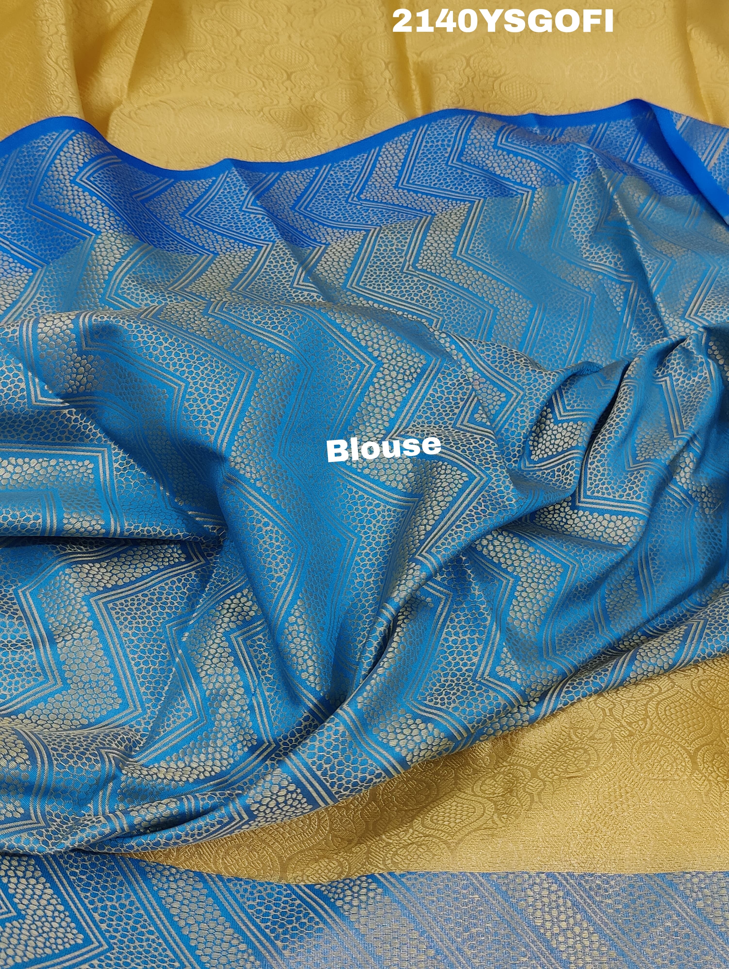 A tissue silk banarasi saree with zari weaving, featuring a blue and gold design on a beige fabric, meant for party or casual wear.