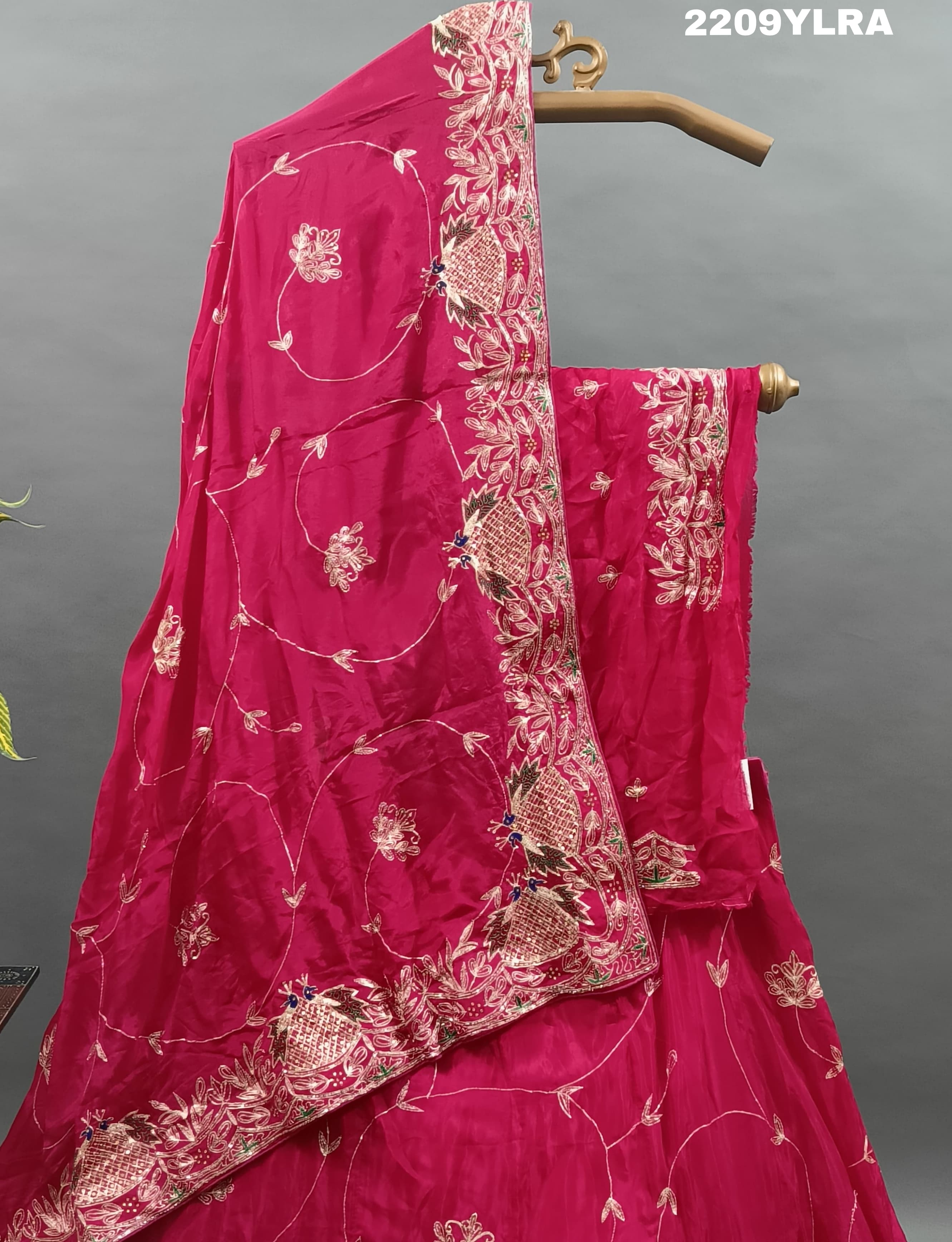 A traditional style pink Chinon silk lehenga with mukesh work