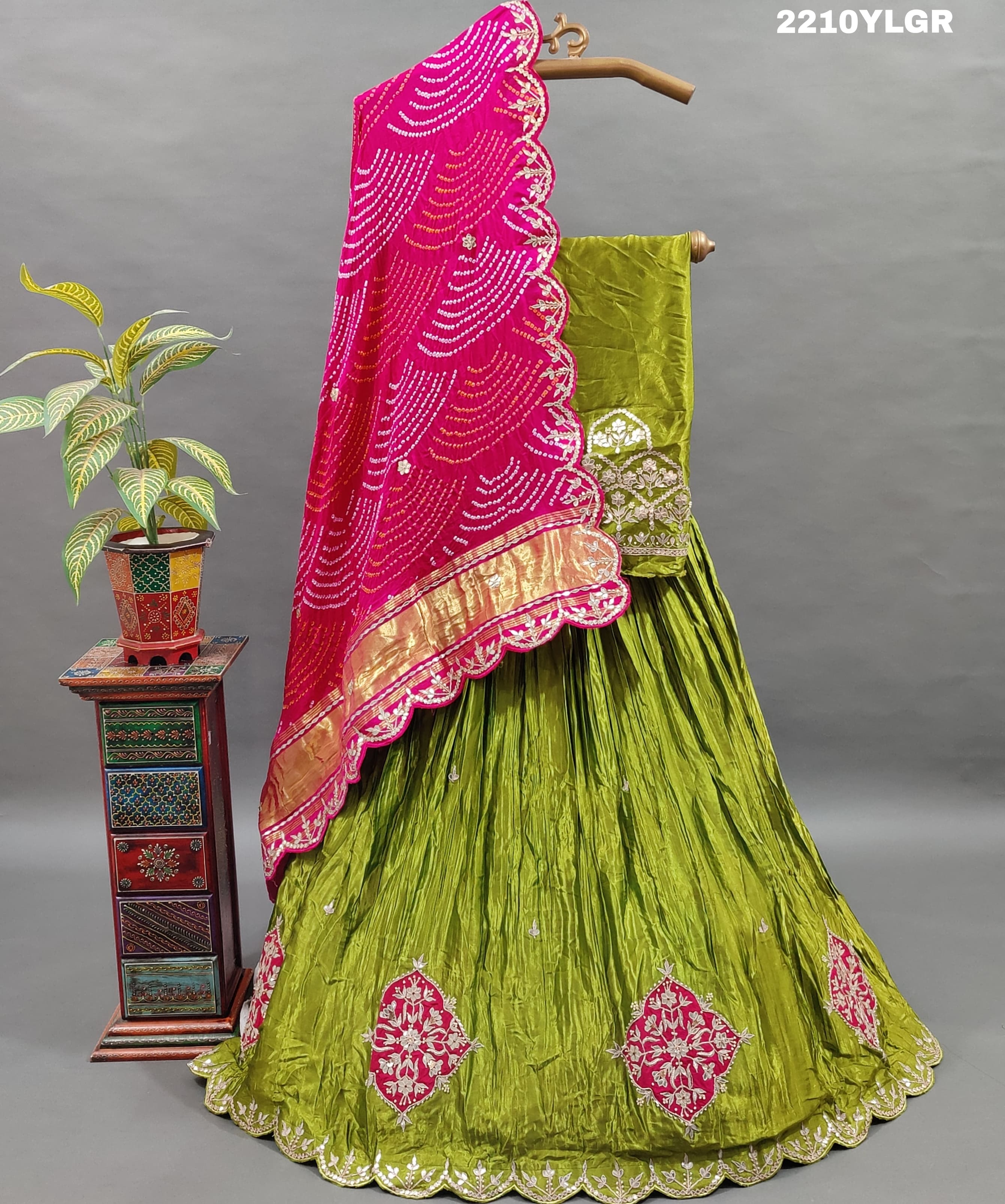 A traditional style lehenga with Bandhani style print and Gota Patti work, featuring green color
